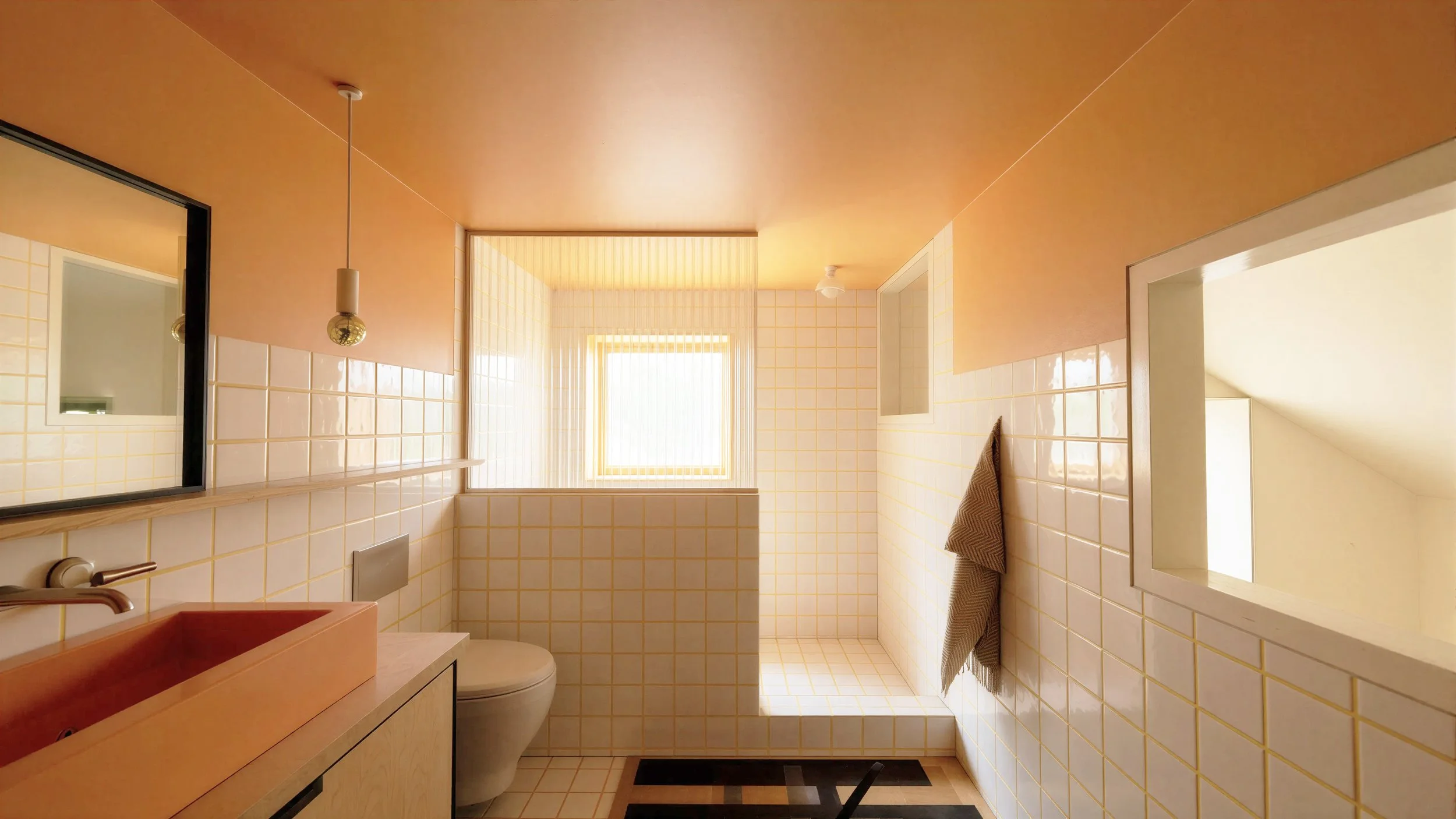 An image of the interior of a contemporary scandivanian rowhouse bathroom with baltic birch plywood, and soft sage green colors. Artek Furniture. HAY furniture. Nashville Designer. Yellow Grout. Colored Grout.