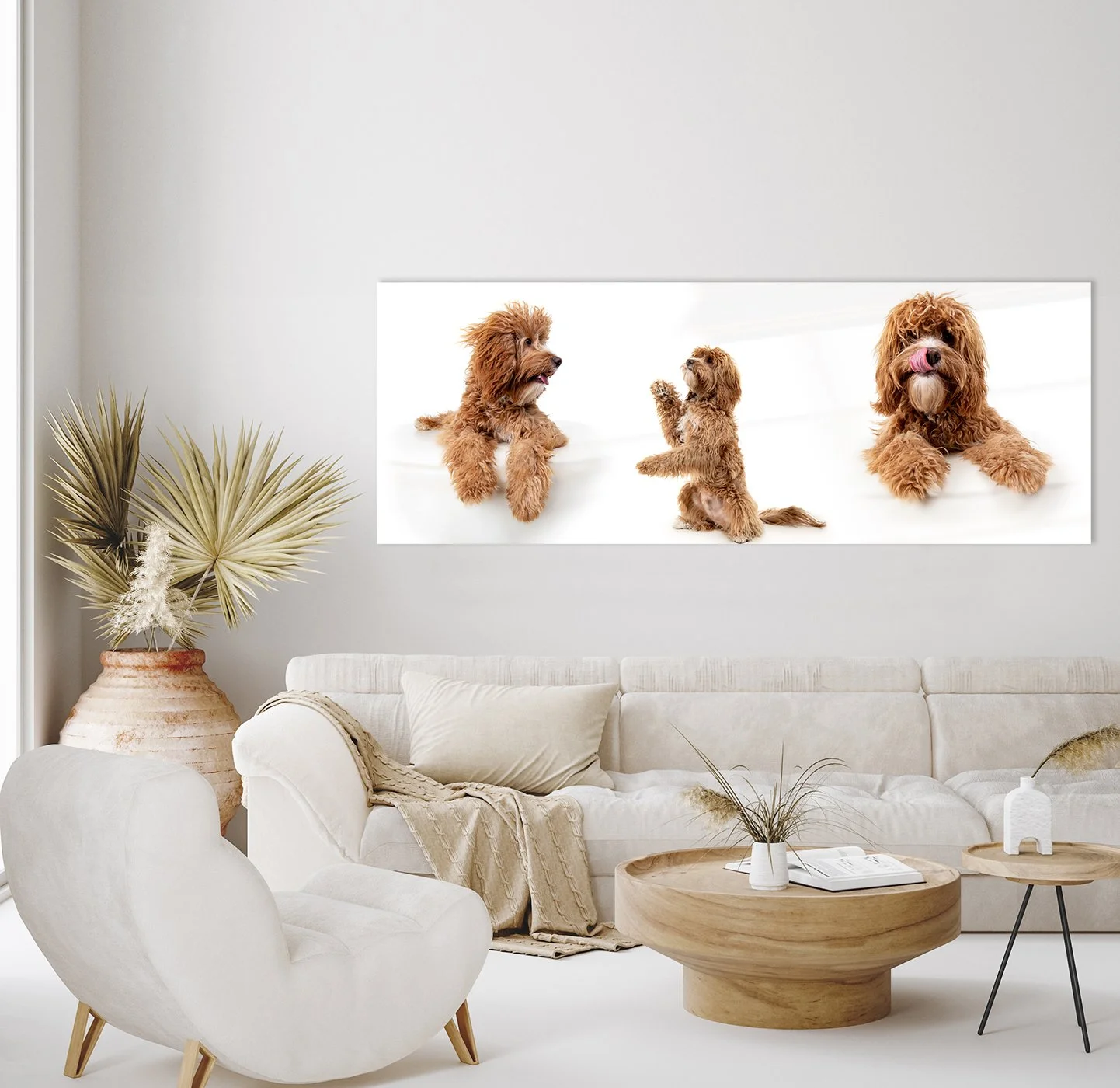 Living room with beige sofa, white armchair, wooden coffee table, and wall art of three dogs in different poses, all with reddish-brown fur.