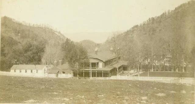 Original 19th century Healing Springs Hotel taken in the early 20th century prior to its becoming the Cascades Inn.  Note the Victorian porches which were replaced with the heavy Greek Revival portico and detailing later in the 20th century