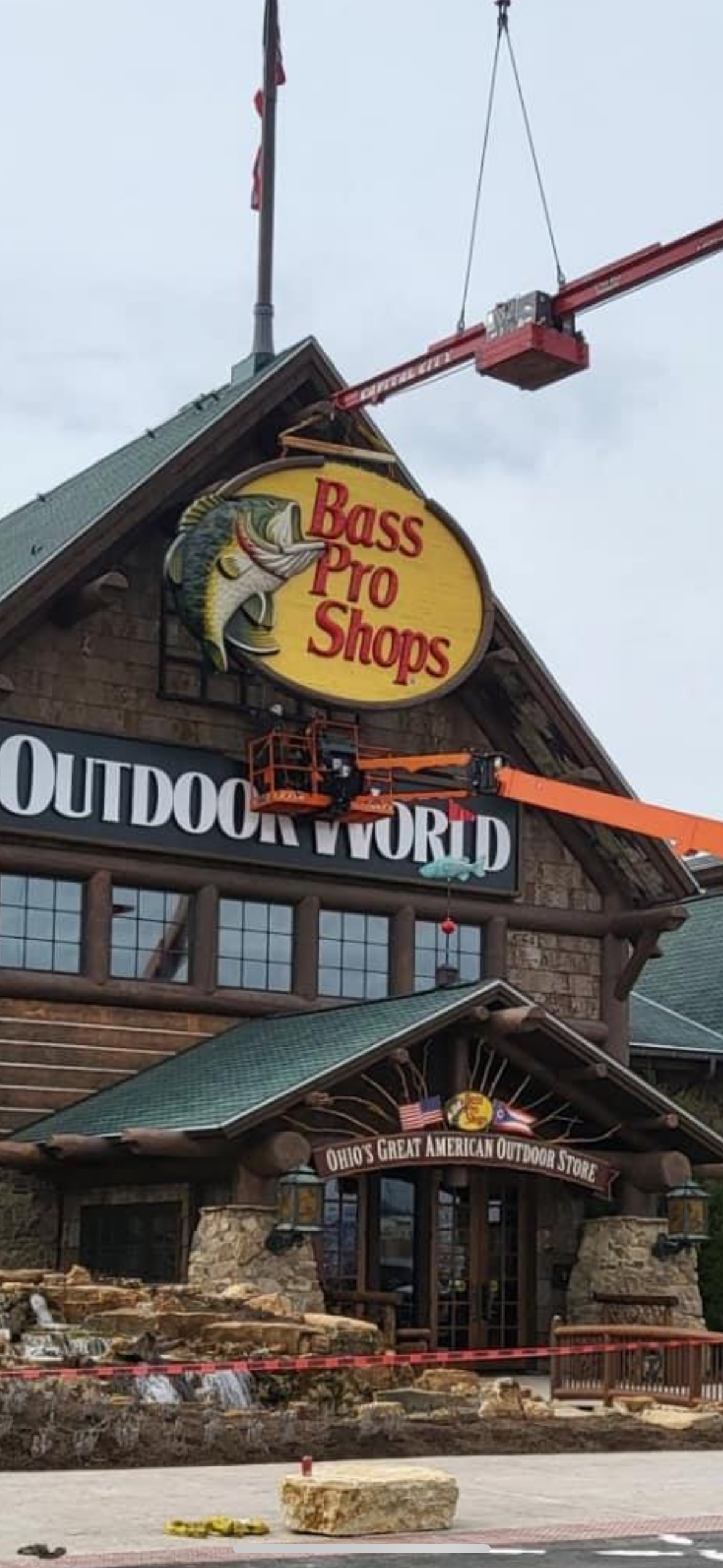 Forward Construction & Signs installing a Bass Pro Shops sign