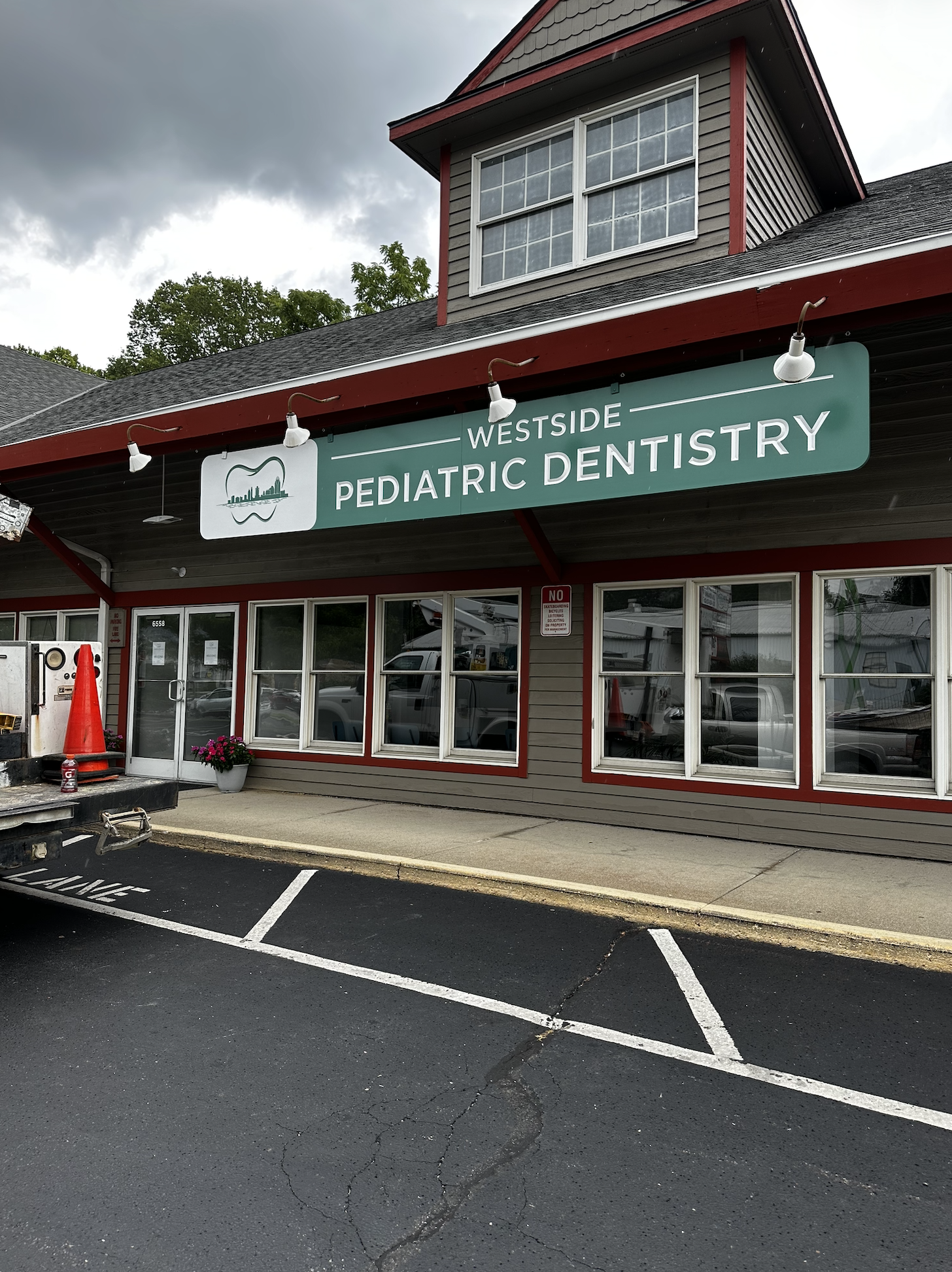 Building sign installation for Westside Pediatric Dentistry in Cincinnati, Ohio
