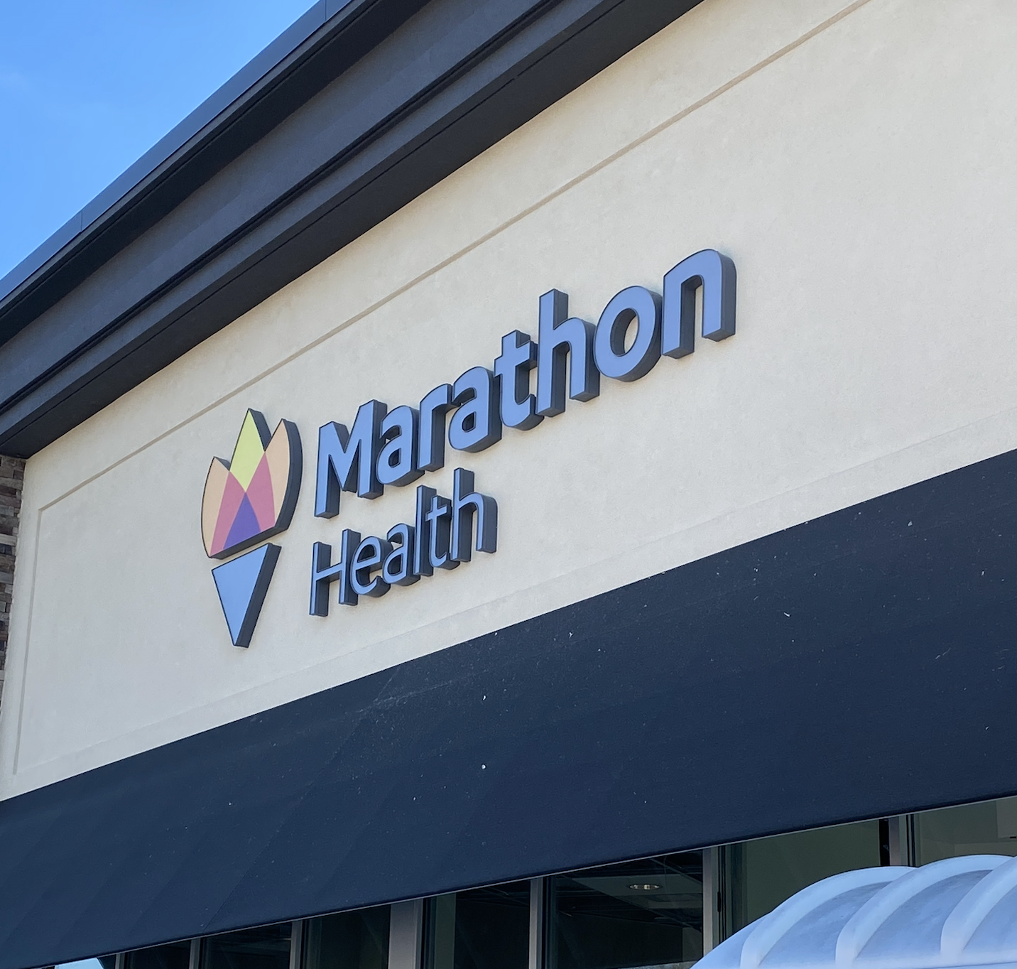 Sign of Marathon Health on a building exterior.