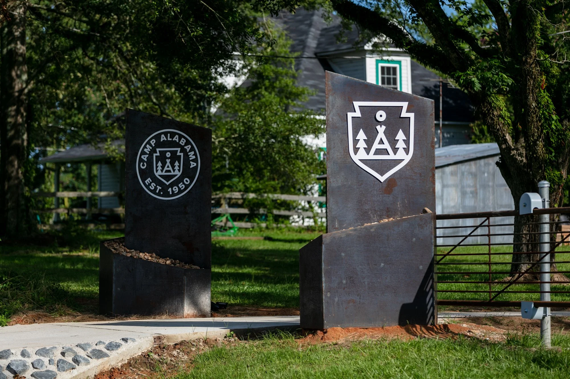 Front gate, two 800 lb pylons with remote operated electric gate.