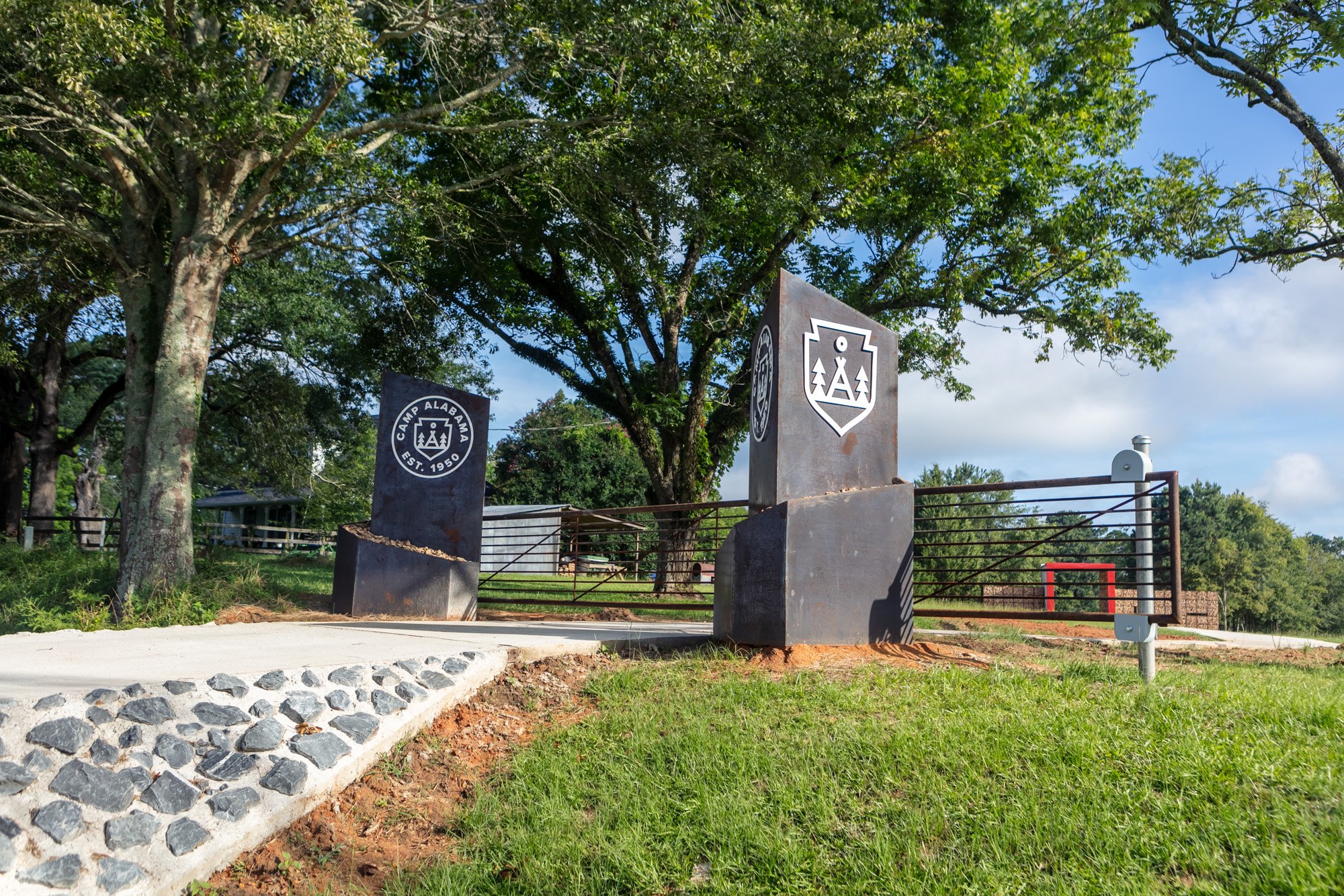 Front gate, two 800 lb pylons with remote operated electric gate.