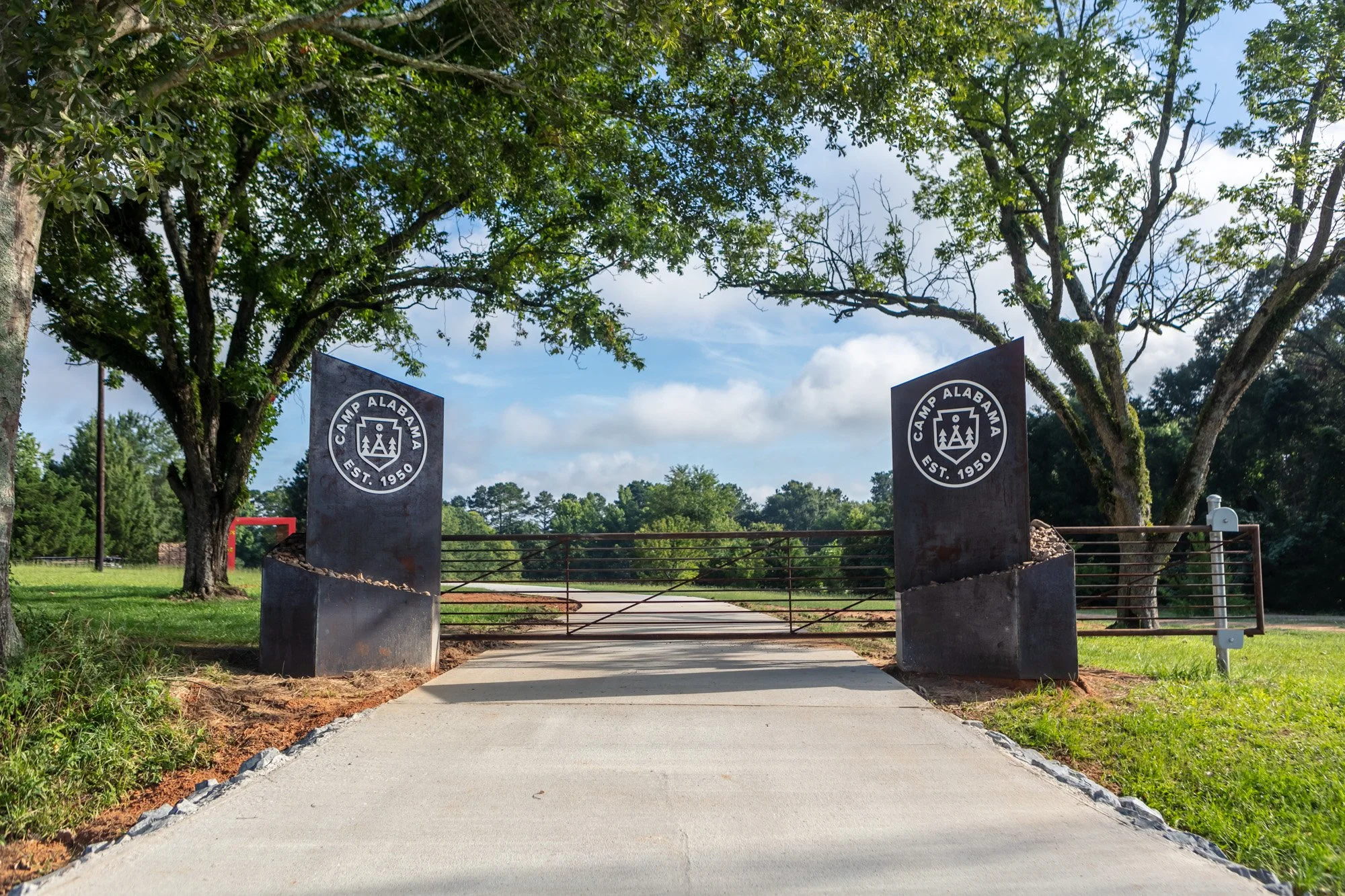 Front gate, two 800 lb pylons with remote operated electric gate.