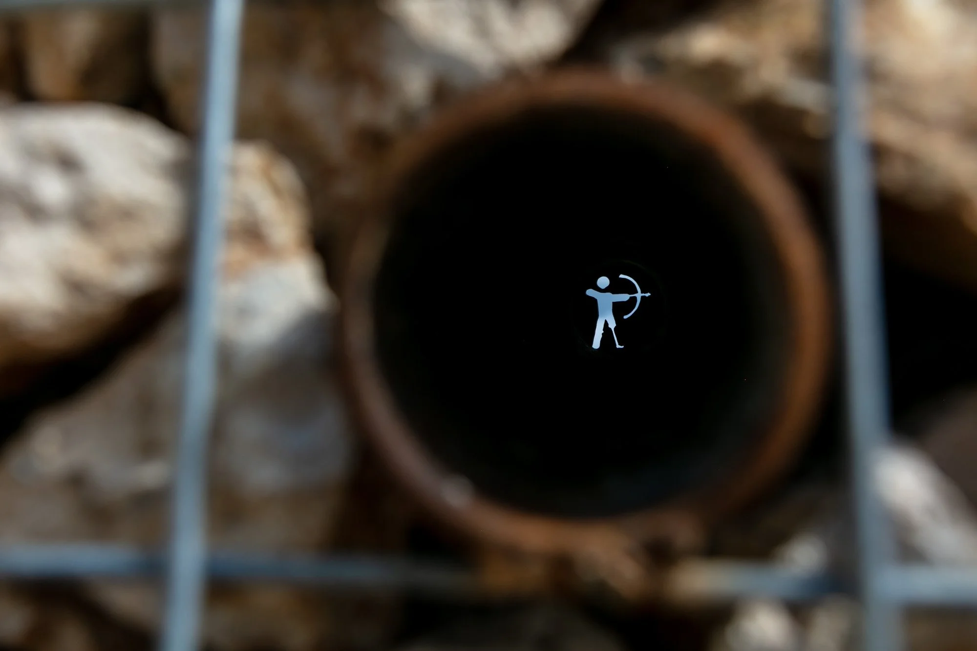 "The Peepholes", designed to give the waiting to start camp peaks through the wall into the activities of the week ahead