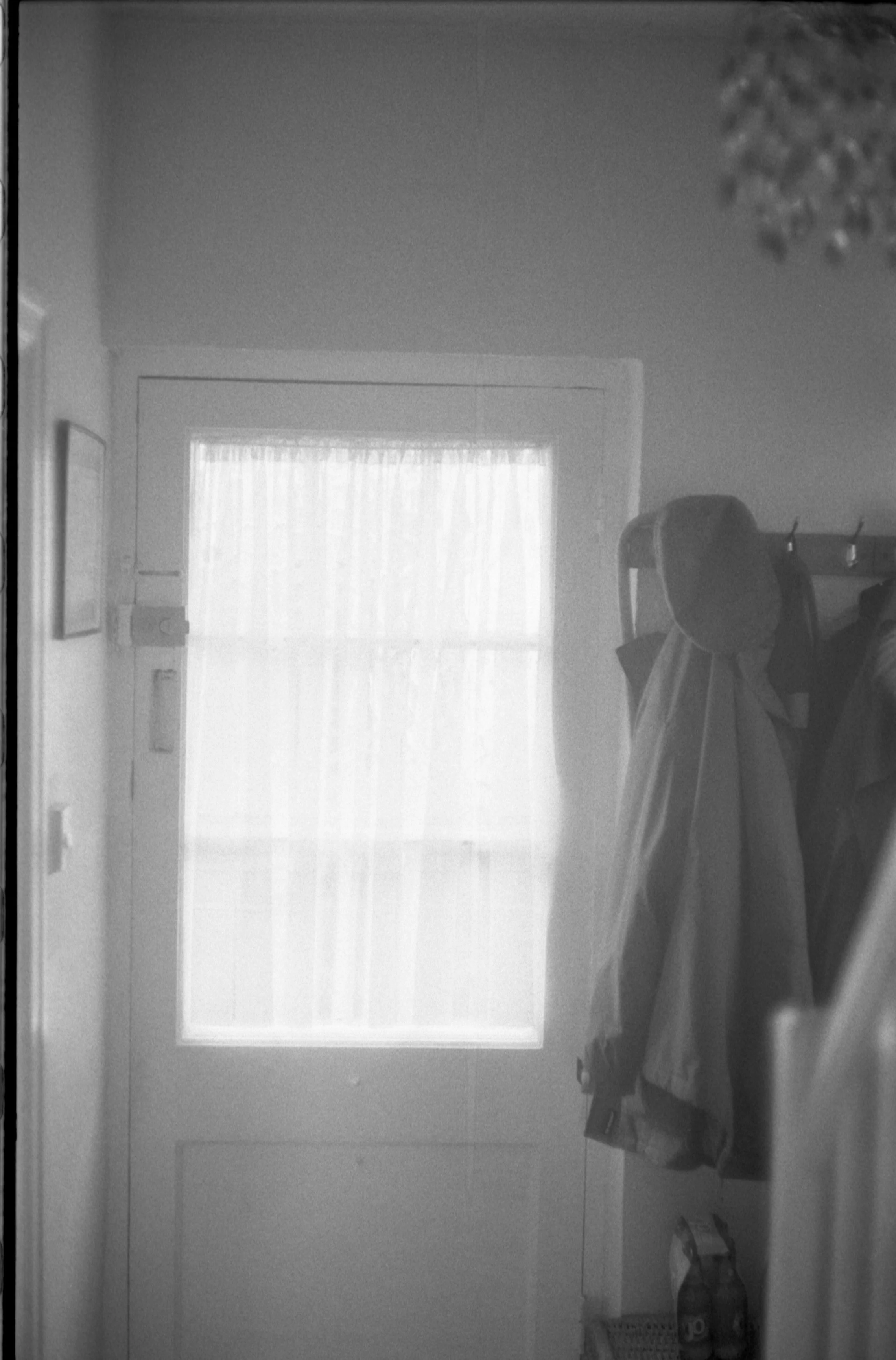 The front door, hat, and coat