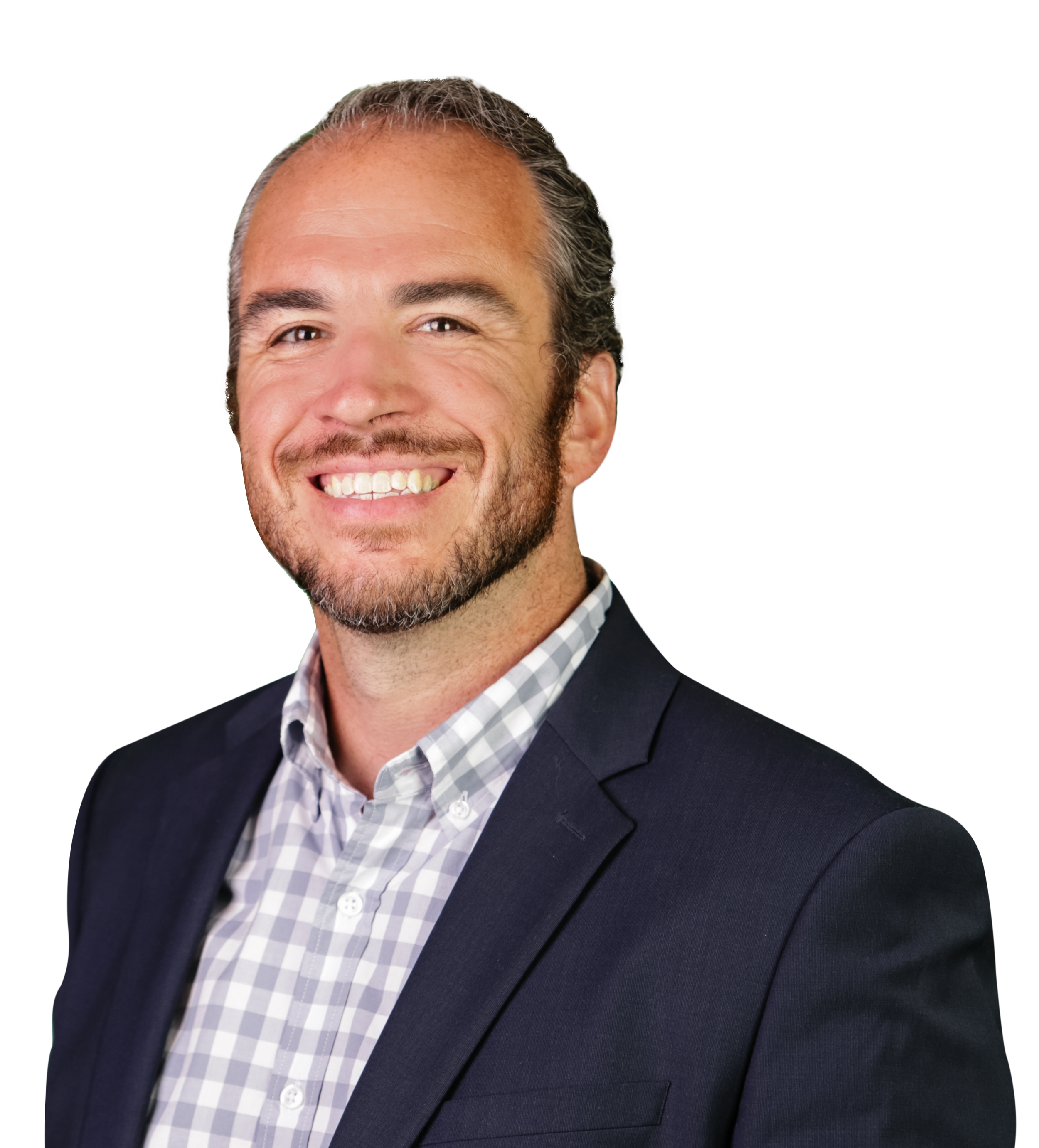 Headshot of a smiling man with short, gray hair and a beard wearing a checked shirt and a dark blazer.
