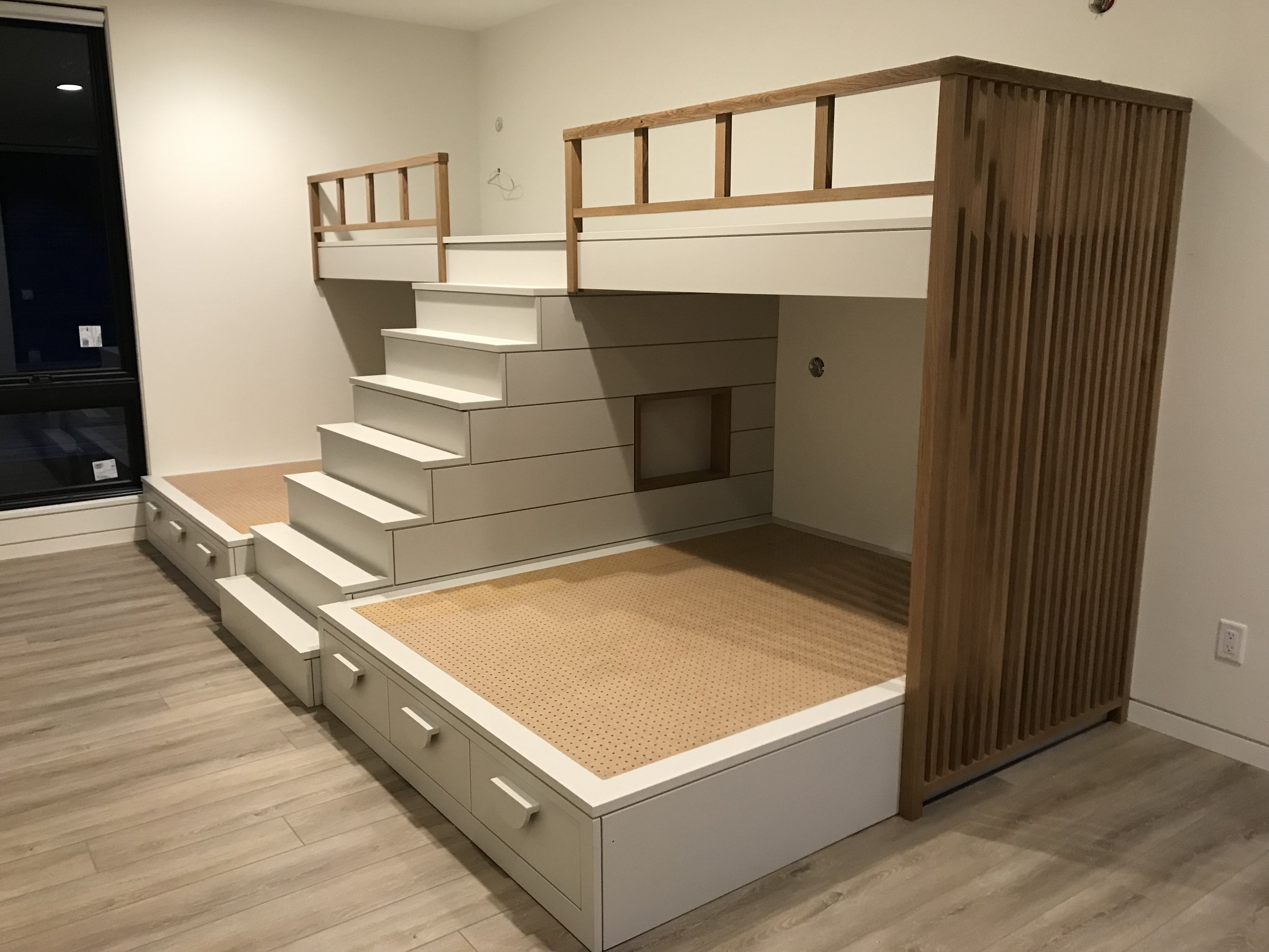 Four Pax bed-stead with white oak slatted wall by Carpenter Ant LLC