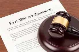 A last will and testament document with a gavel resting on top