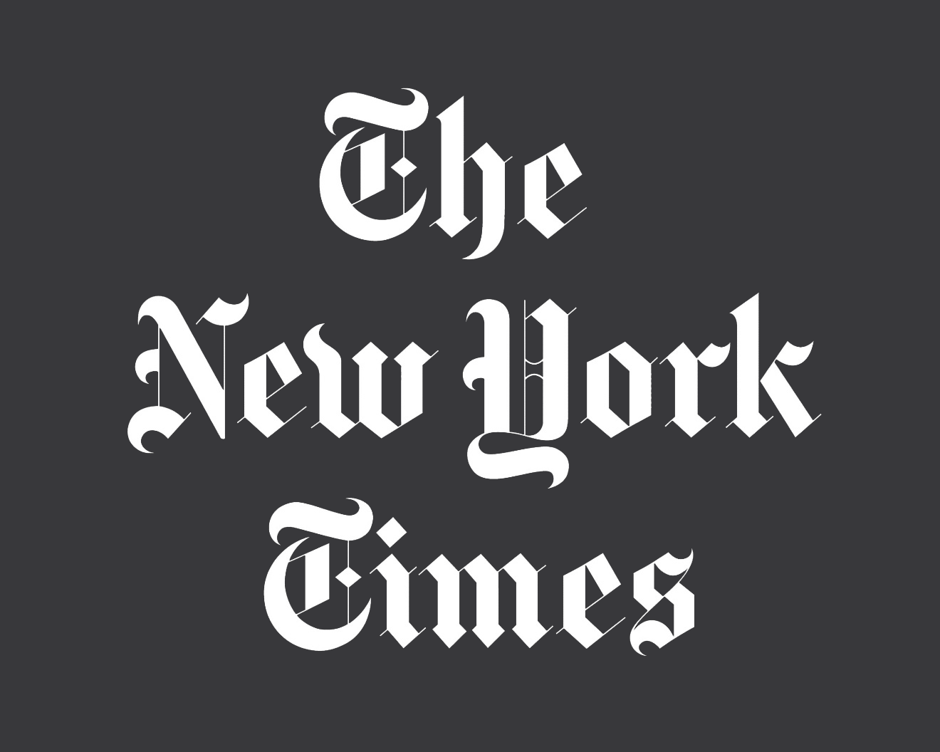 Text reading 'The New York Times' in blackletter font on a dark gray background.