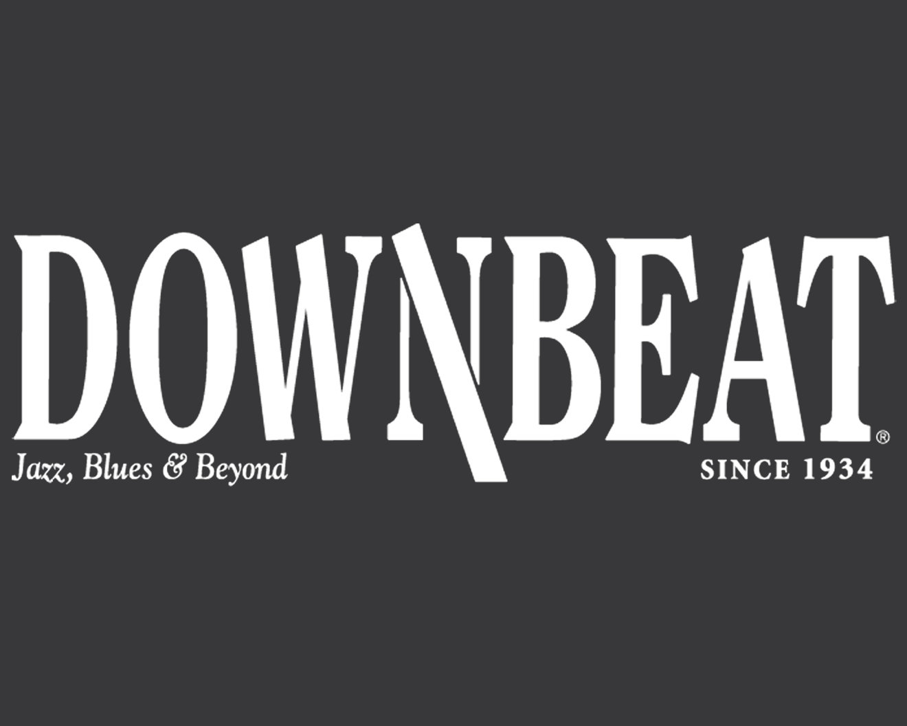 Logo for Downbeat, a jazz, blues, and beyond music publication, established in 1934, with bold white text on a dark gray background.