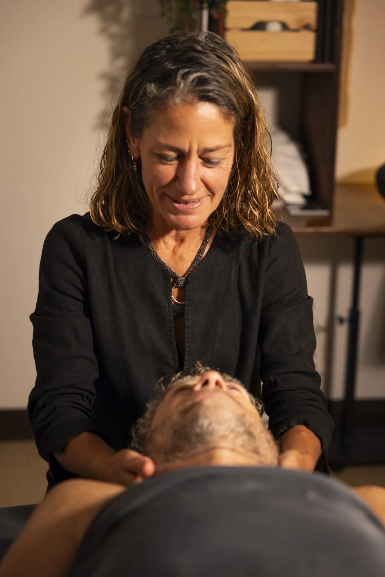 Dr. Decker is ending a massage session with some cranial sacral work and neck massage