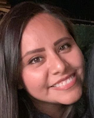 Close-up image of Adriana Arteta, Licensed Professional Counselor, MA, LPC smiling.
