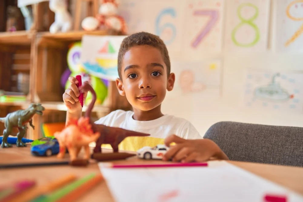 Child with toys in therapy
