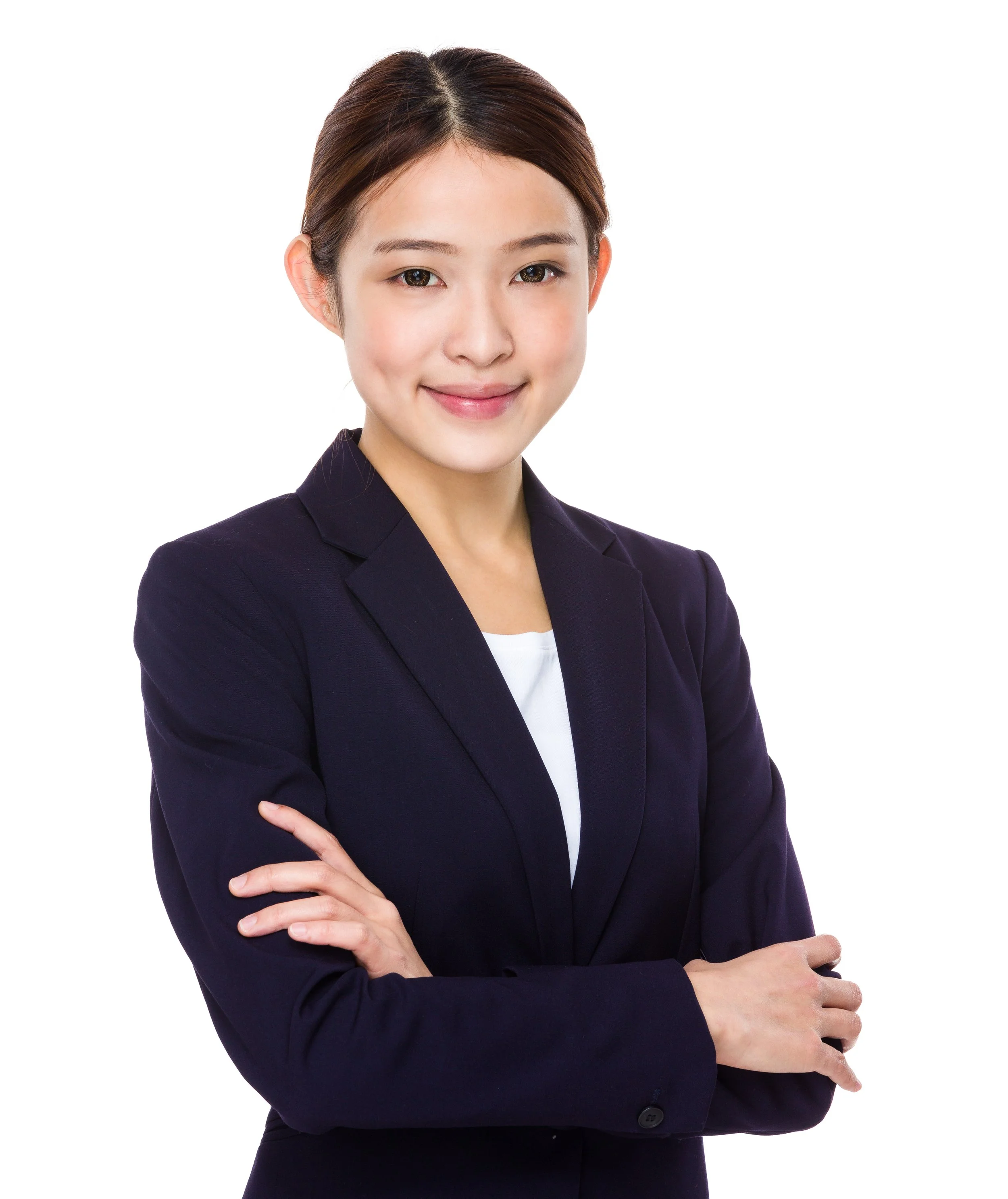 A woman with short hair wearing a dark blazer and white top, smiling with arms crossed, against a white background.