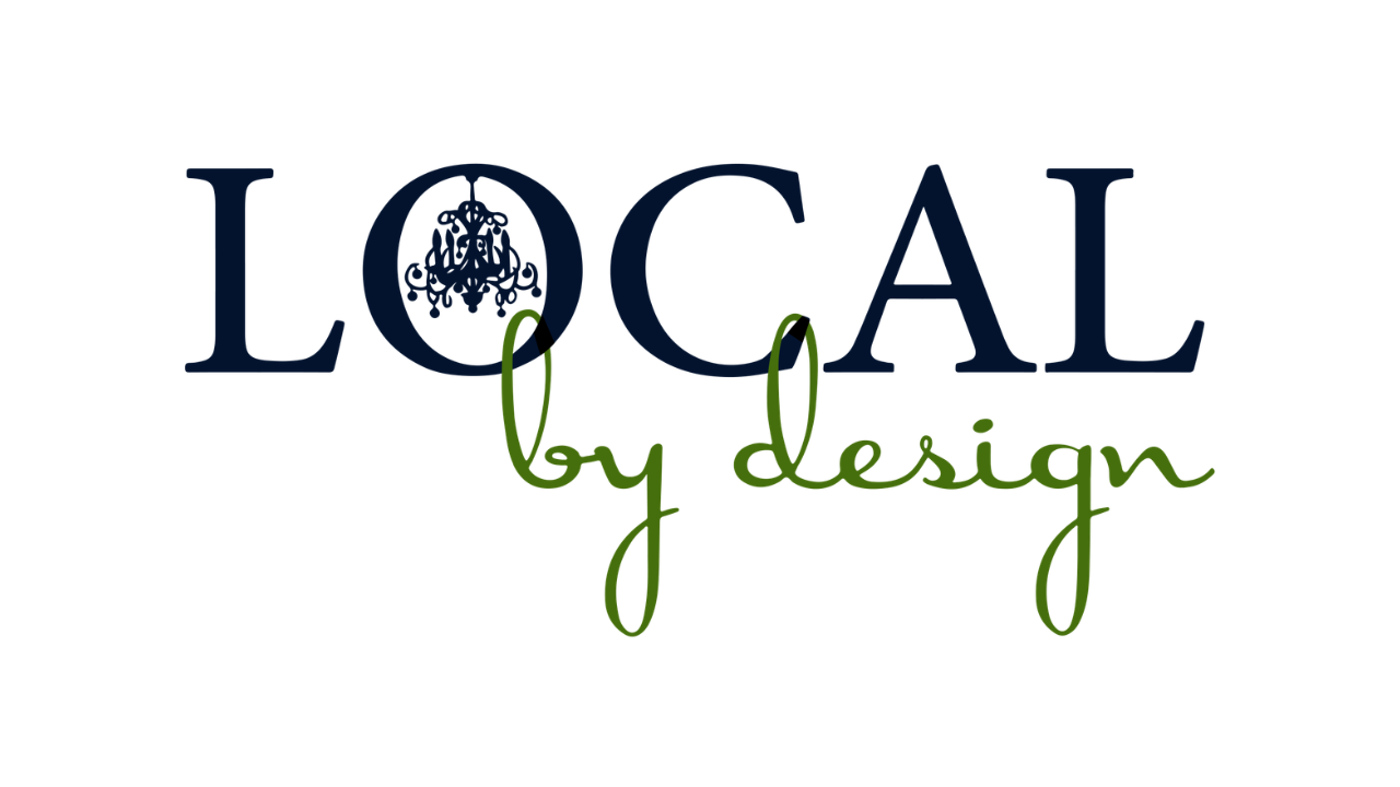 Logo with the words "LOCAL by design"; "LOCAL" in navy blue with a chandelier inside the letter 'O,' and "by design" in green cursive underneath.
