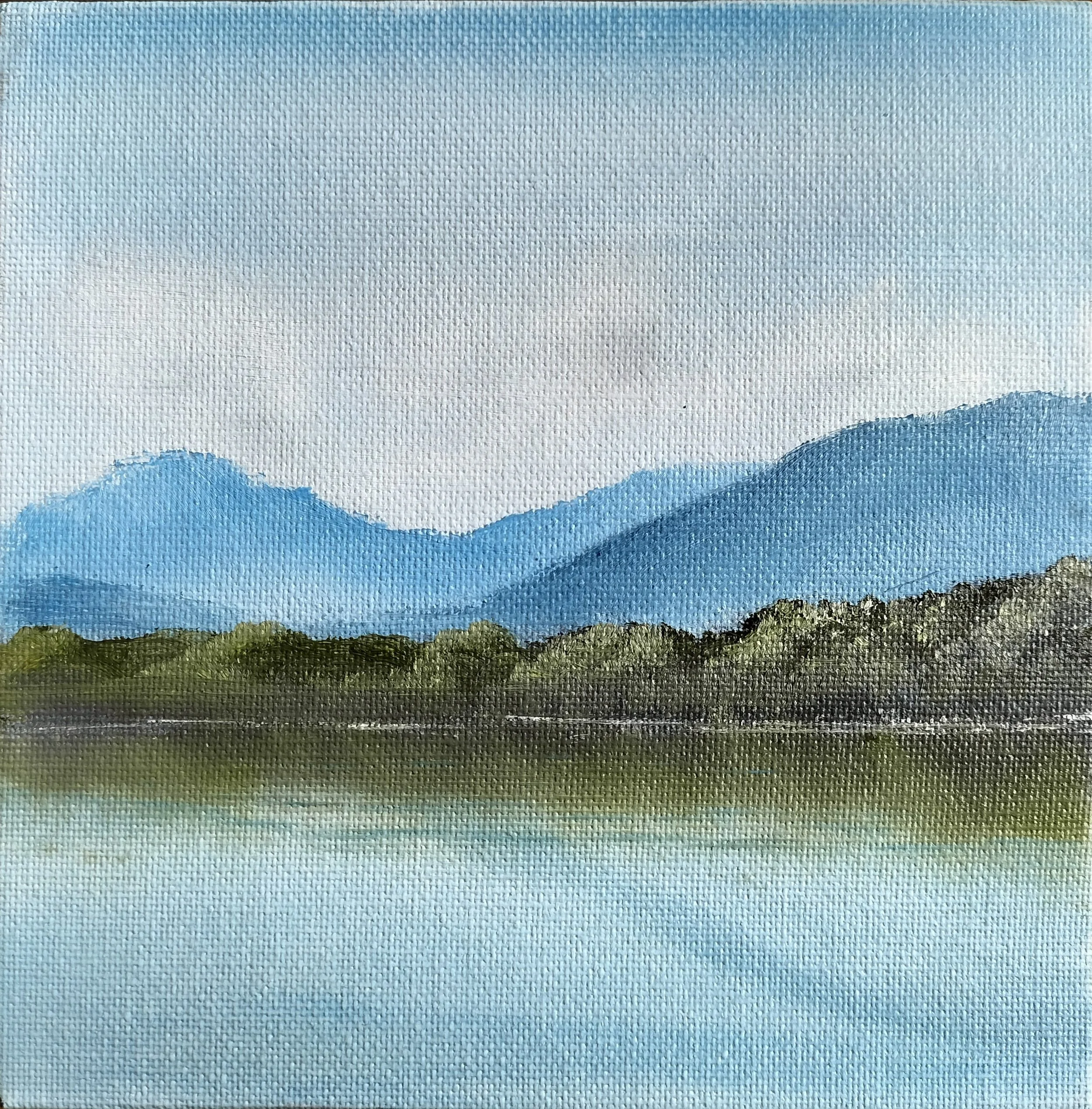 A painting of a landscape with blue mountains, green trees, and a body of water reflecting the scenery.