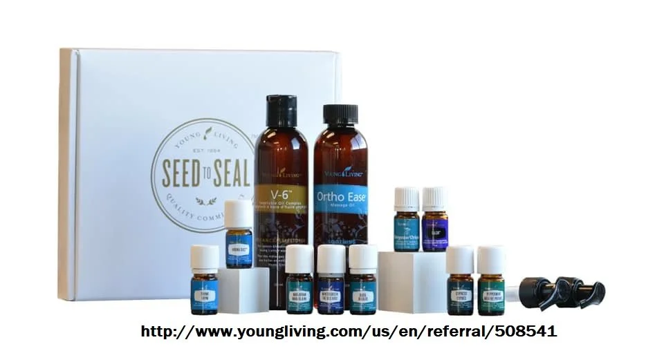 Set of essential oils and massage oils with a white box in the background, labeled 'Seed to Seal' and 'Young Living'.