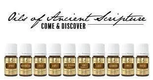 A row of eight small bottles labeled as oils of ancient scripture, with the caption 'Oils of Ancient Scripture' and 'Come & Discover' above them.