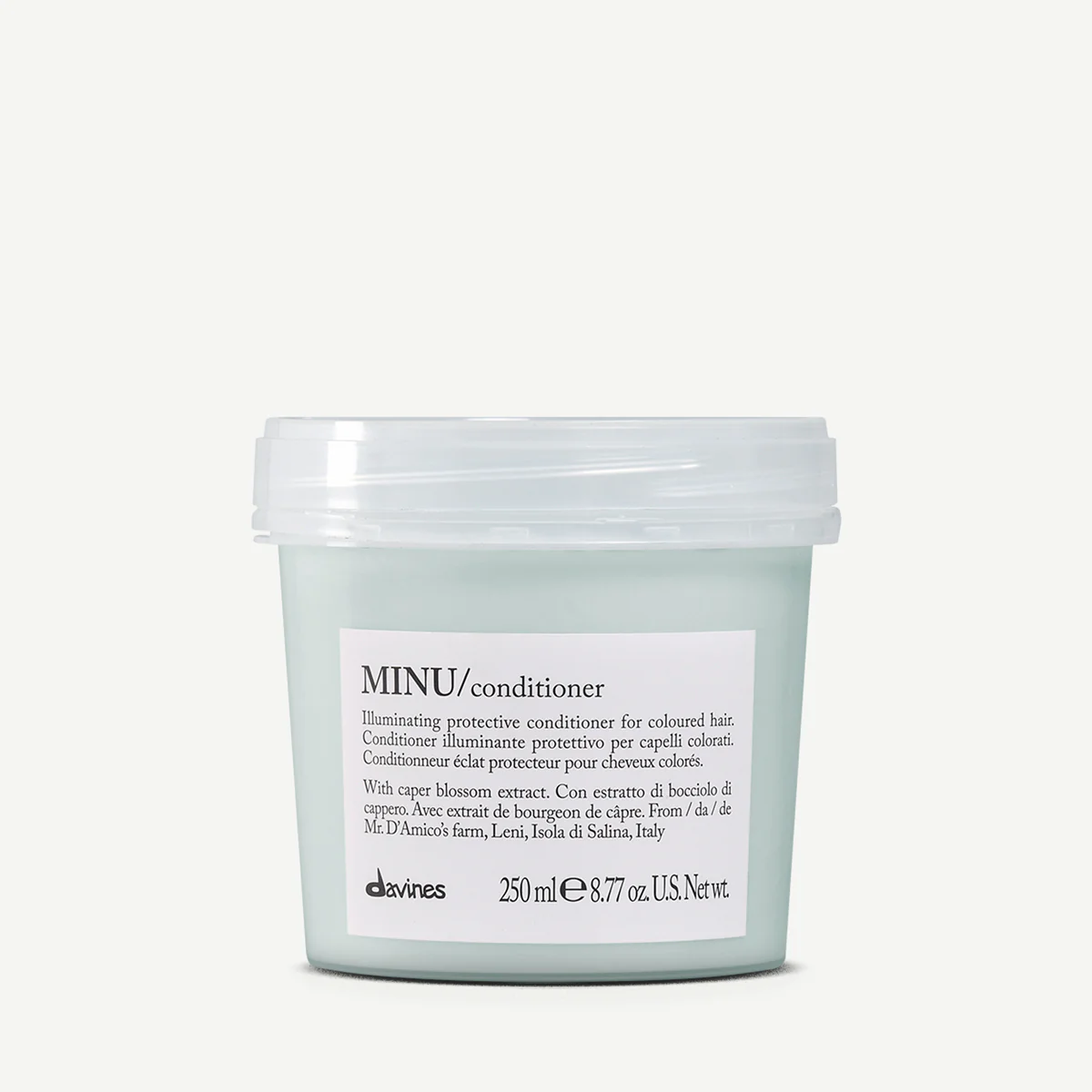 A container of MINU conditioner with white label, black text, and clear lid, containing illuminating protective conditioner for colored hair.