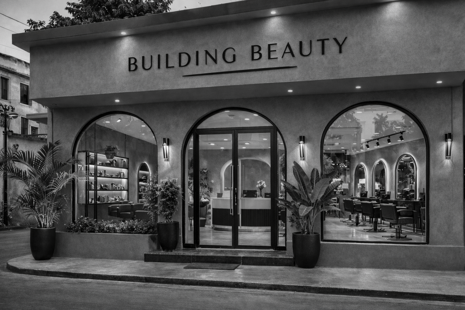 The exterior of a beauty salon with large arched windows and glass double doors, potted plants outside, and the words 'BUILDING BEAUTY' on the front wall.