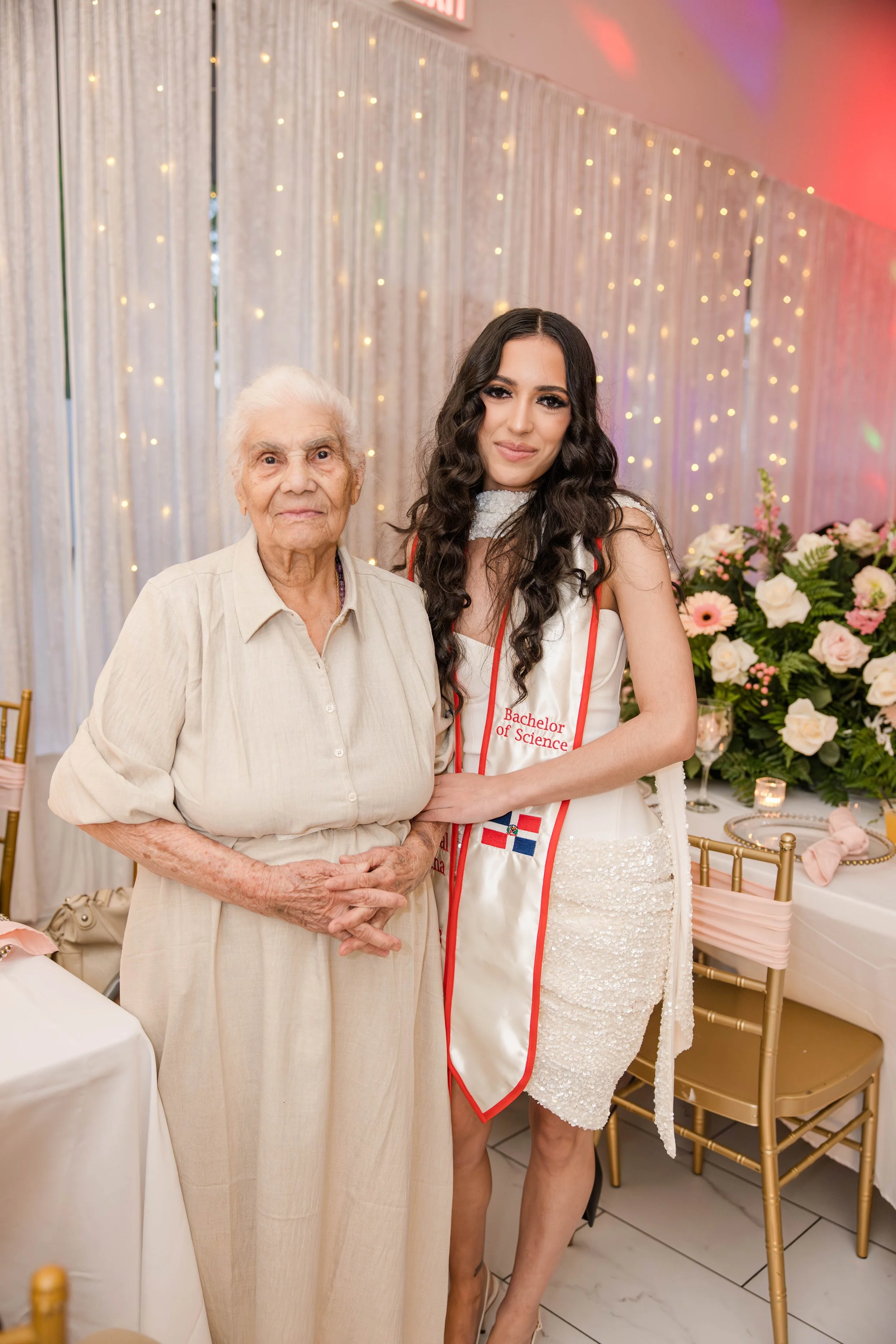 graduation portrait with college graduate and grandmother at a Long Island family celebration photographed by Moon & Stars Photography.