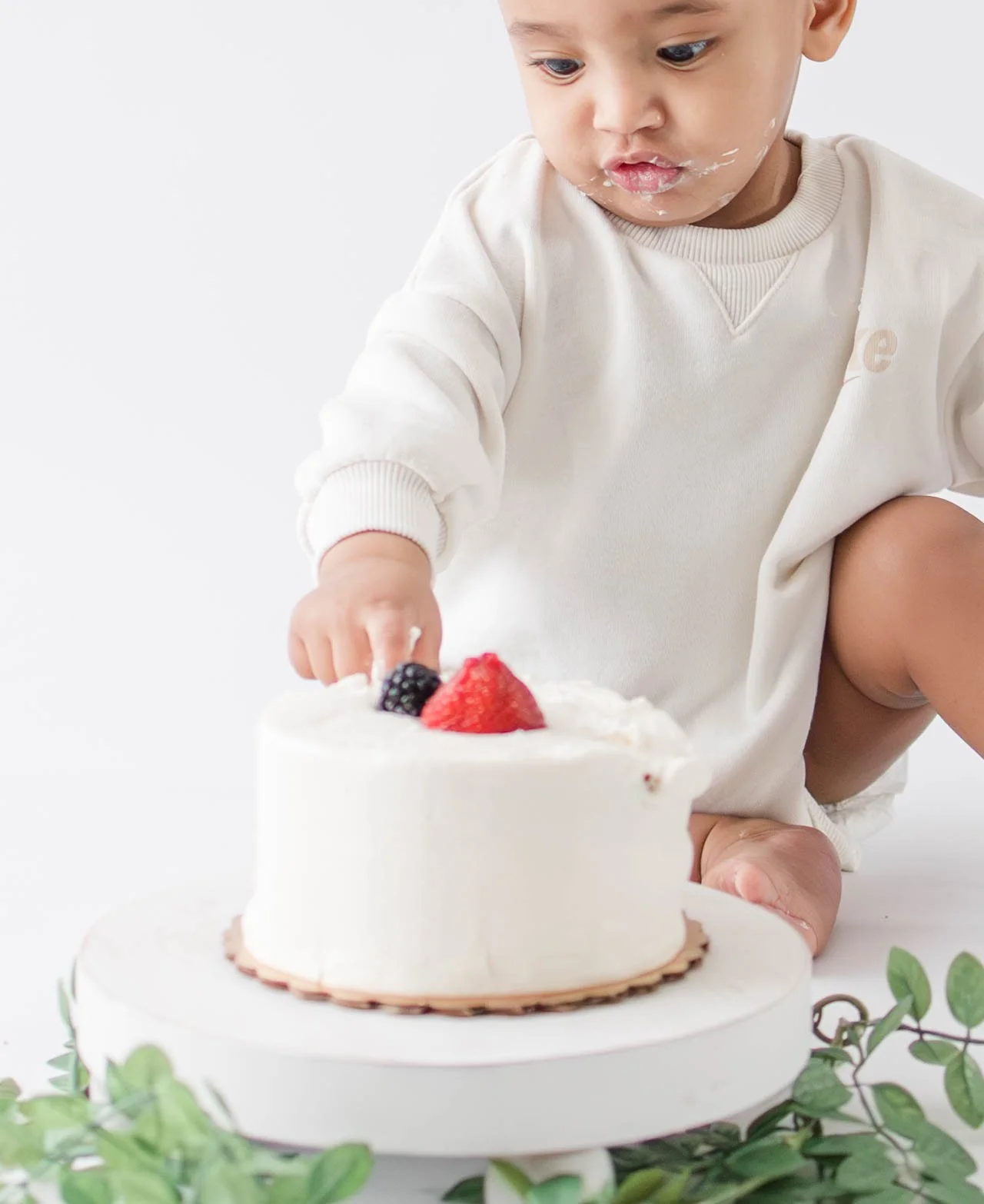long-island-cake-smash-session-baby-touching-cake-closeup.jpg