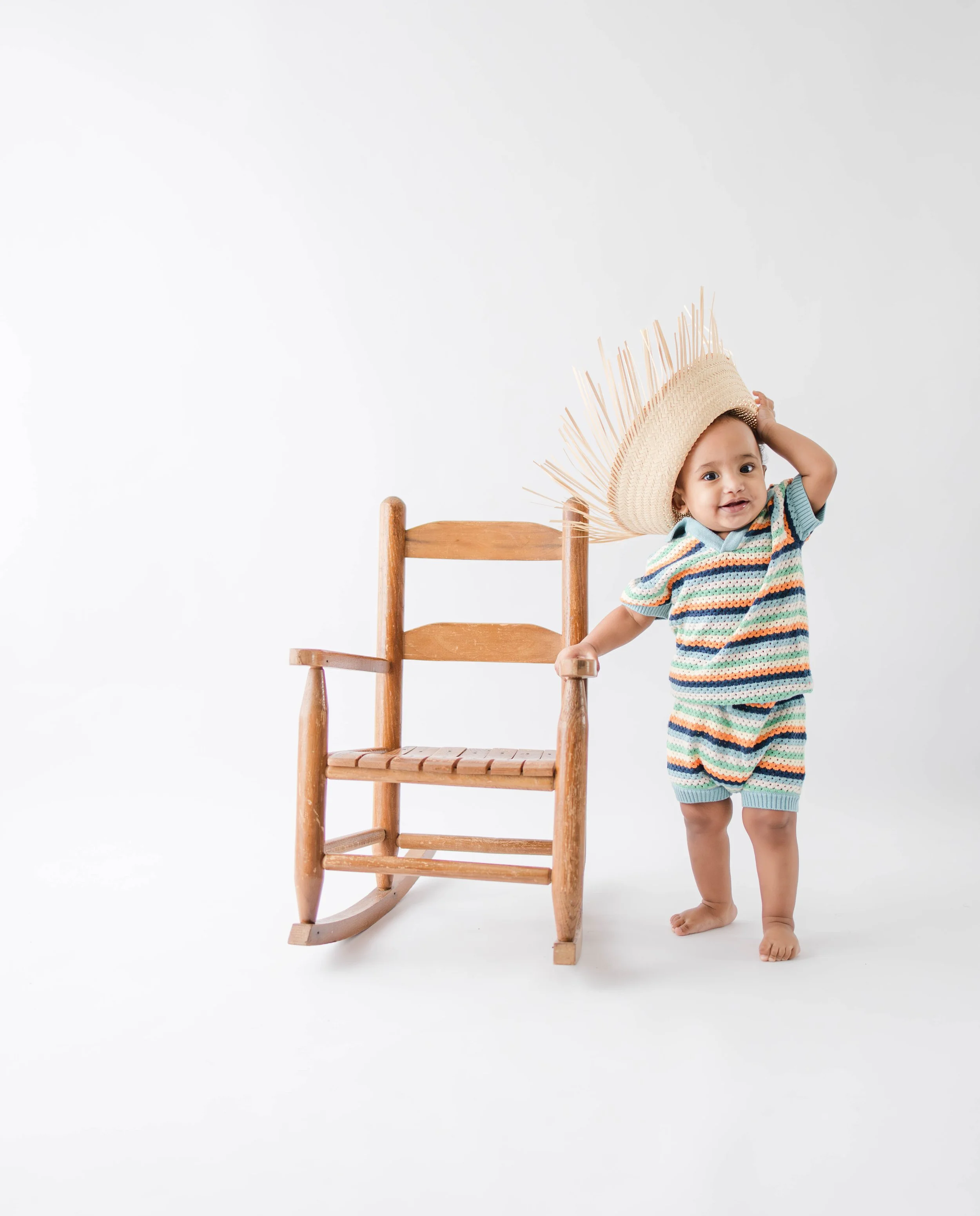 nassau-county-cake-smash-photography-baby-with-hat-chair.jpg