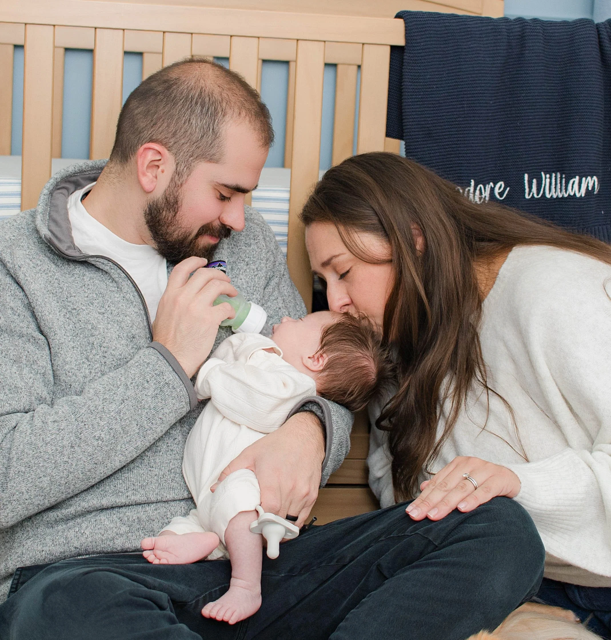 long-island-newborn-lifestyle-session-parents-feeding-baby.jpg