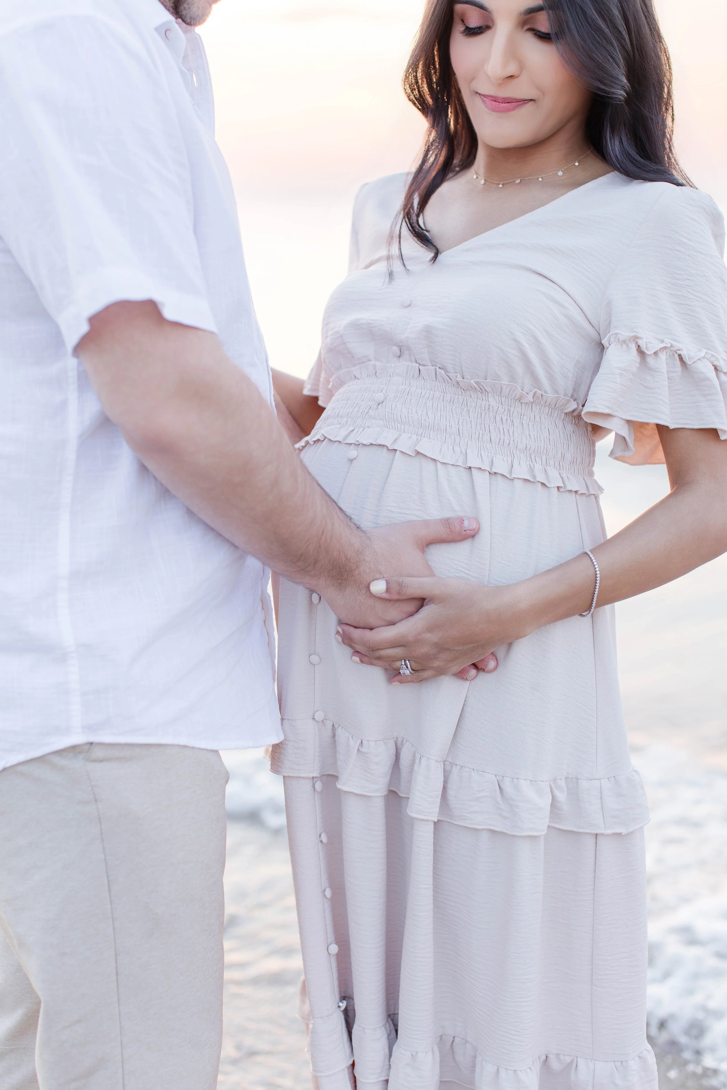 Sunset maternity photography session at Sunken Meadow State Park featuring an expecting family, photographed by a Long Island maternity photographer serving Nassau and Suffolk County.