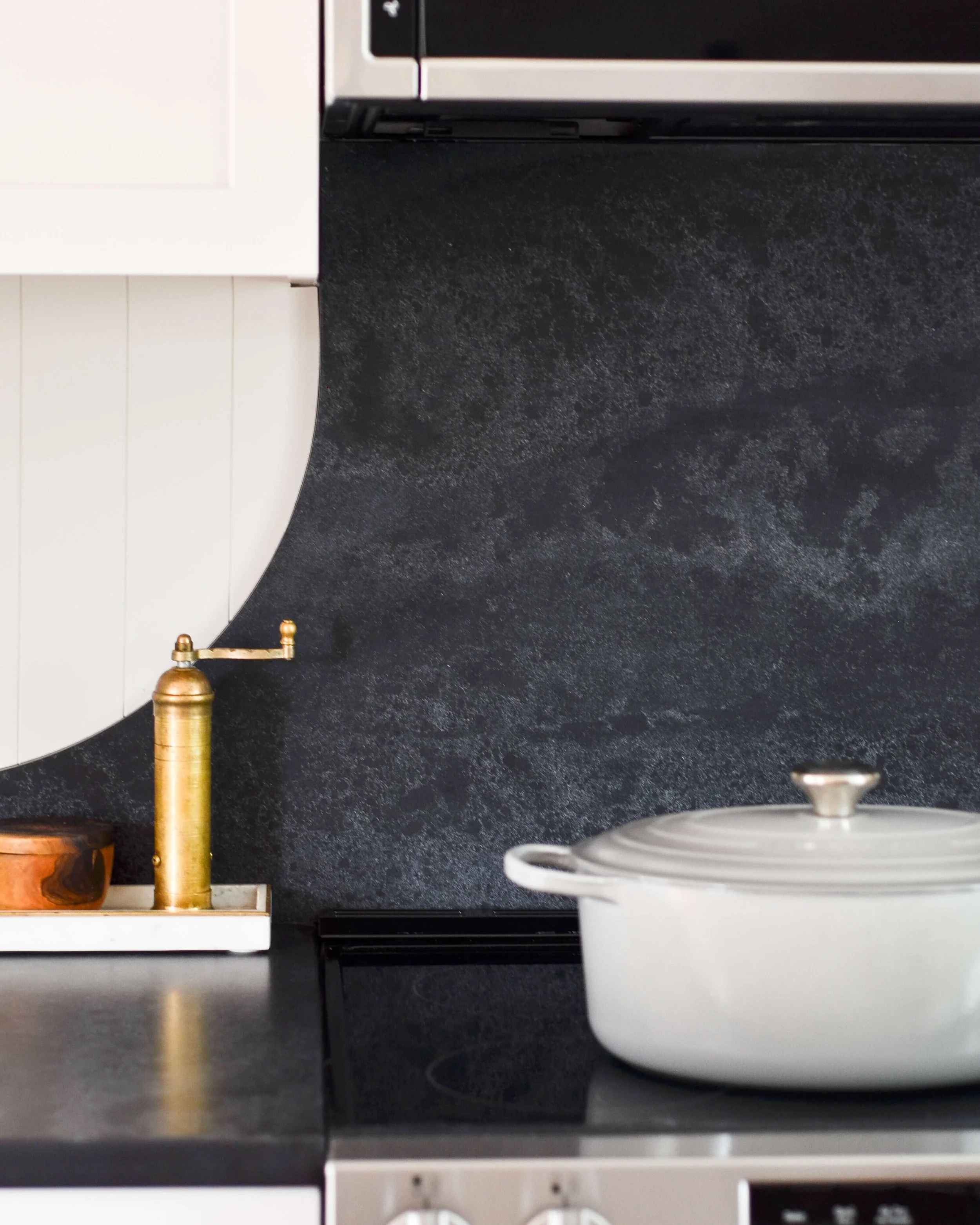 Where radius natural stone meets vertical shiplap - a close look at two textures resolved into one clean line.
