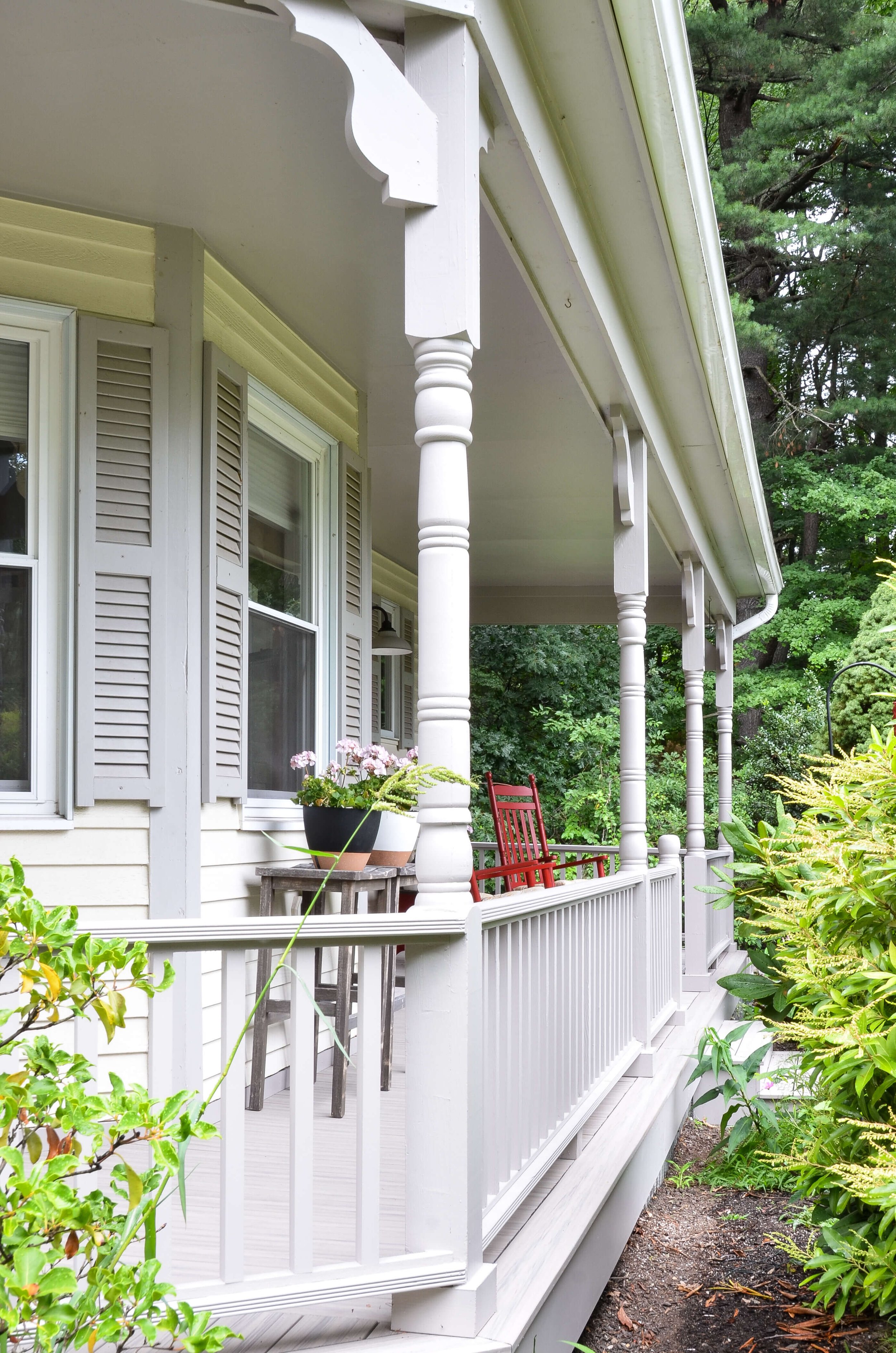Turned posts and scrolled brackets give this front porch its classic character.