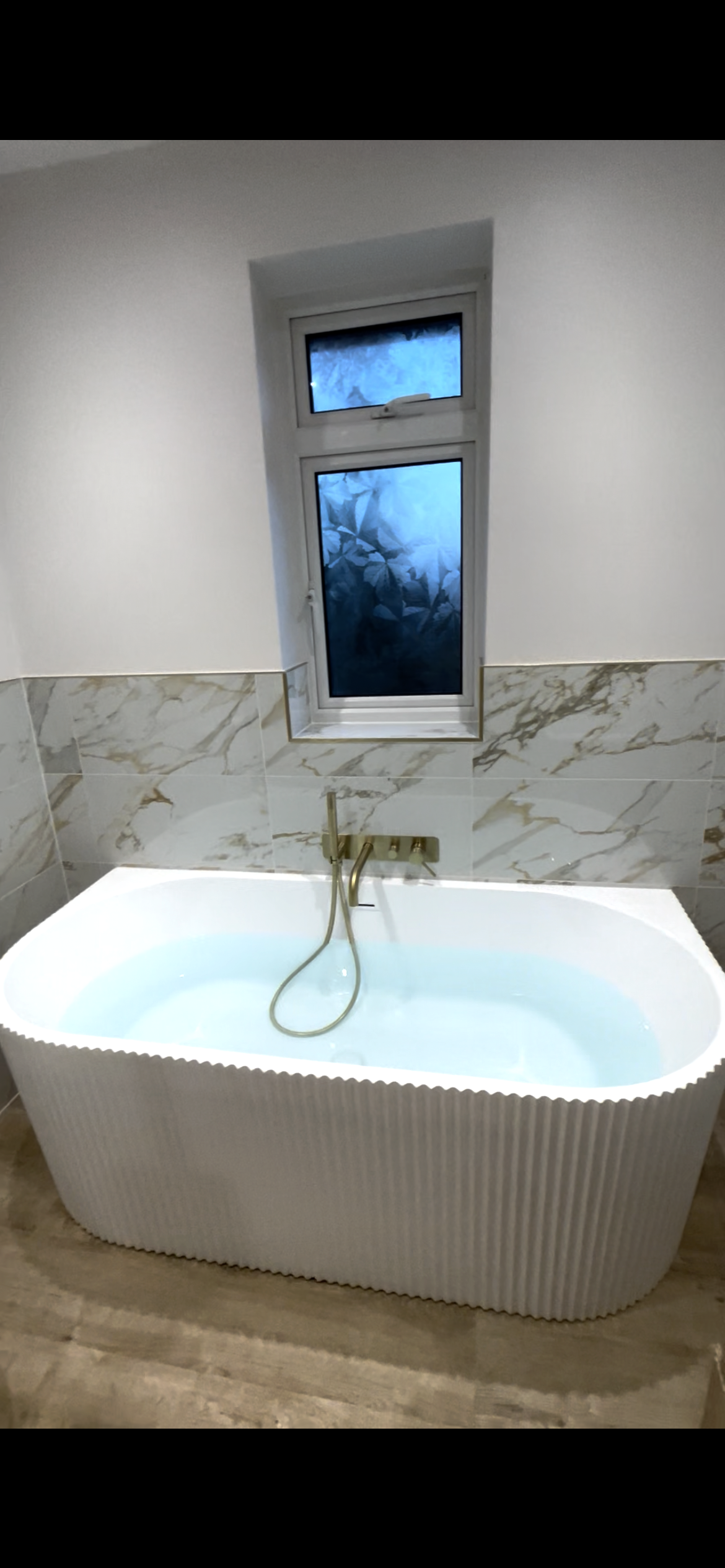 Luxury bathroom renovation with freestanding bath and feature tiling in Shrewsbury, Shropshire