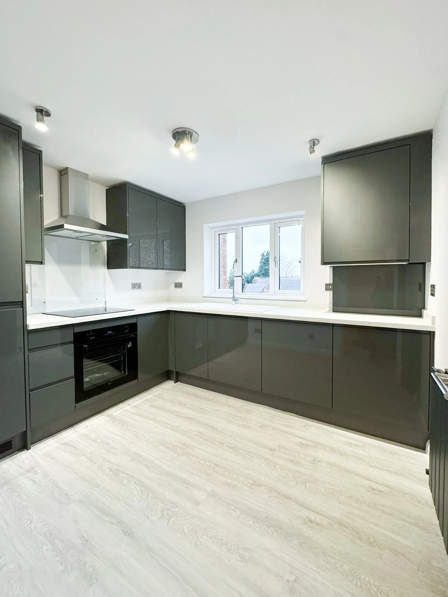 Contemporary kitchen renovation with fitted cabinetry, worktops and flooring