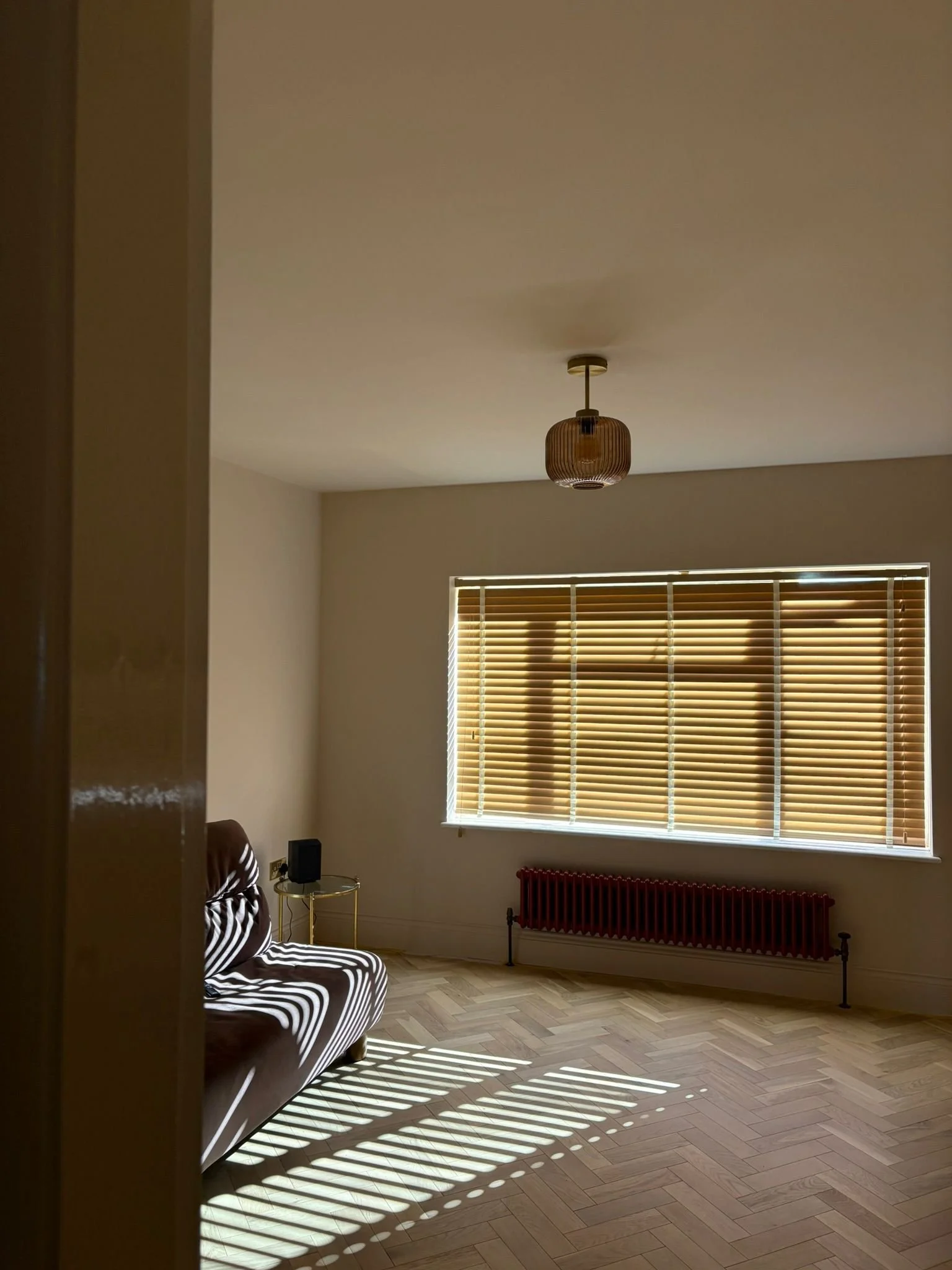 Engineered oak herringbone flooring installed in a renovated living space