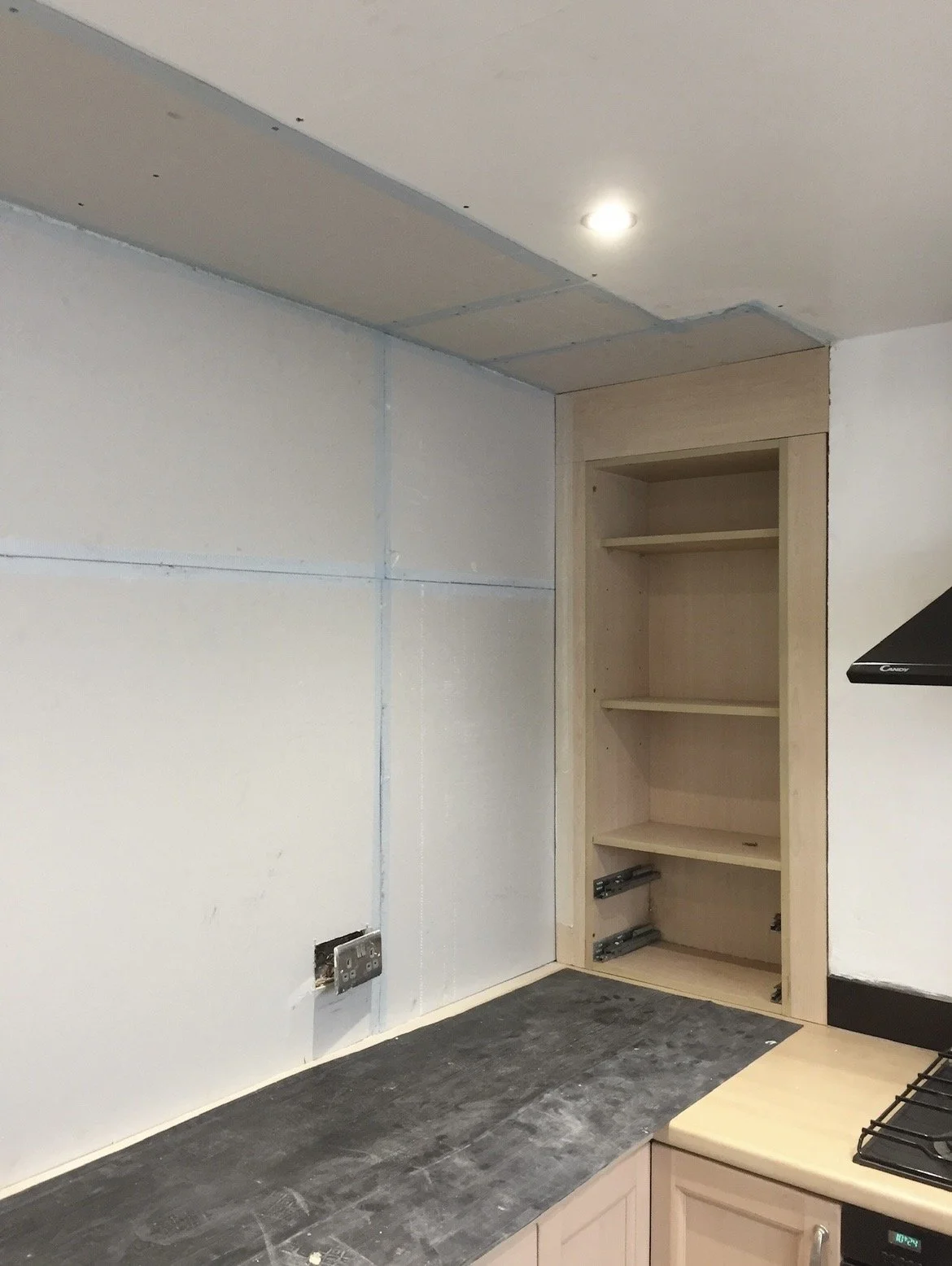 Damp-treated walls plasterboarded and joints prepared ready for the final plaster skim.