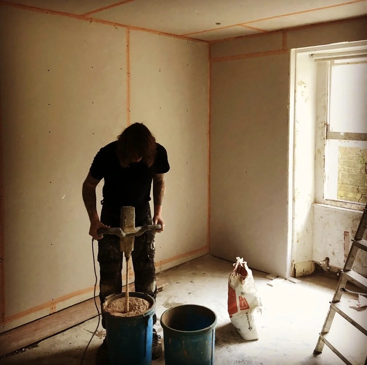 Mixing plaster on site during plastering and renovation works