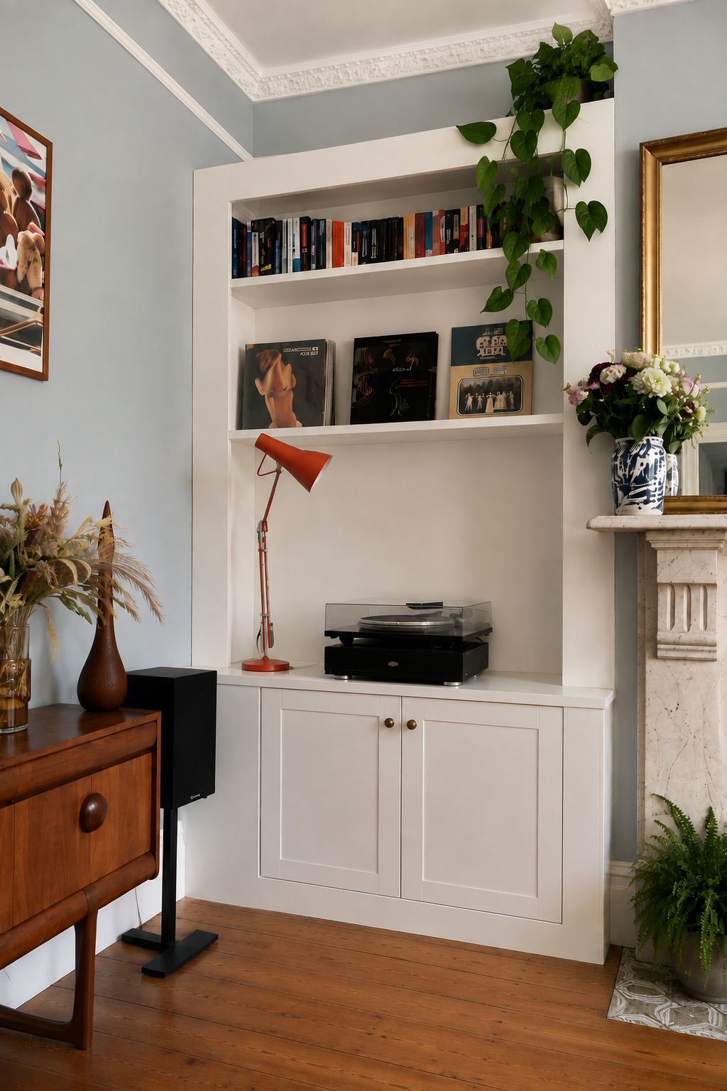 Bespoke fitted furniture designed to house a record player, vinyl collection and books, with integrated cabinet storage