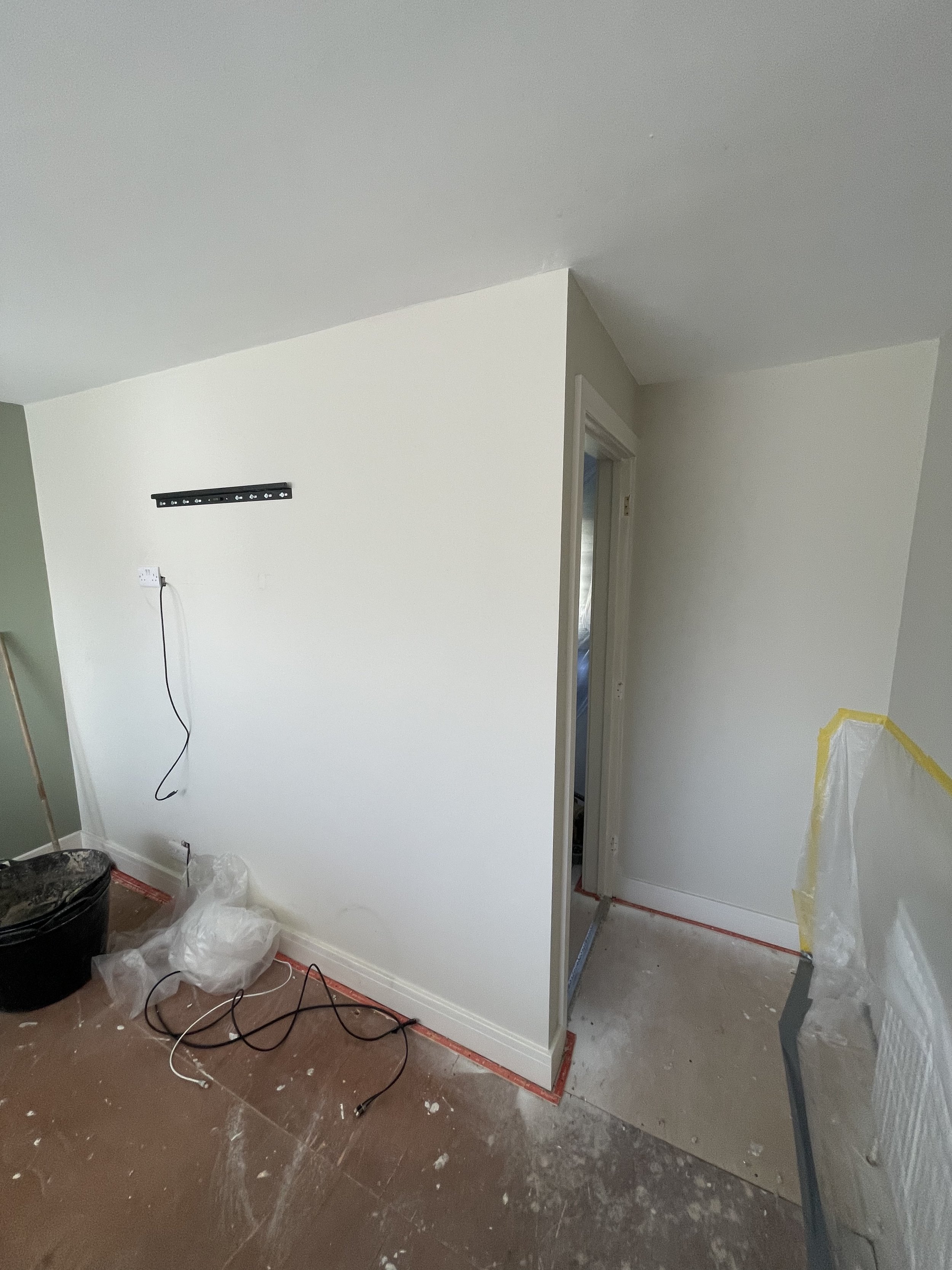 Existing living space before internal alterations to reposition the wall and doorway