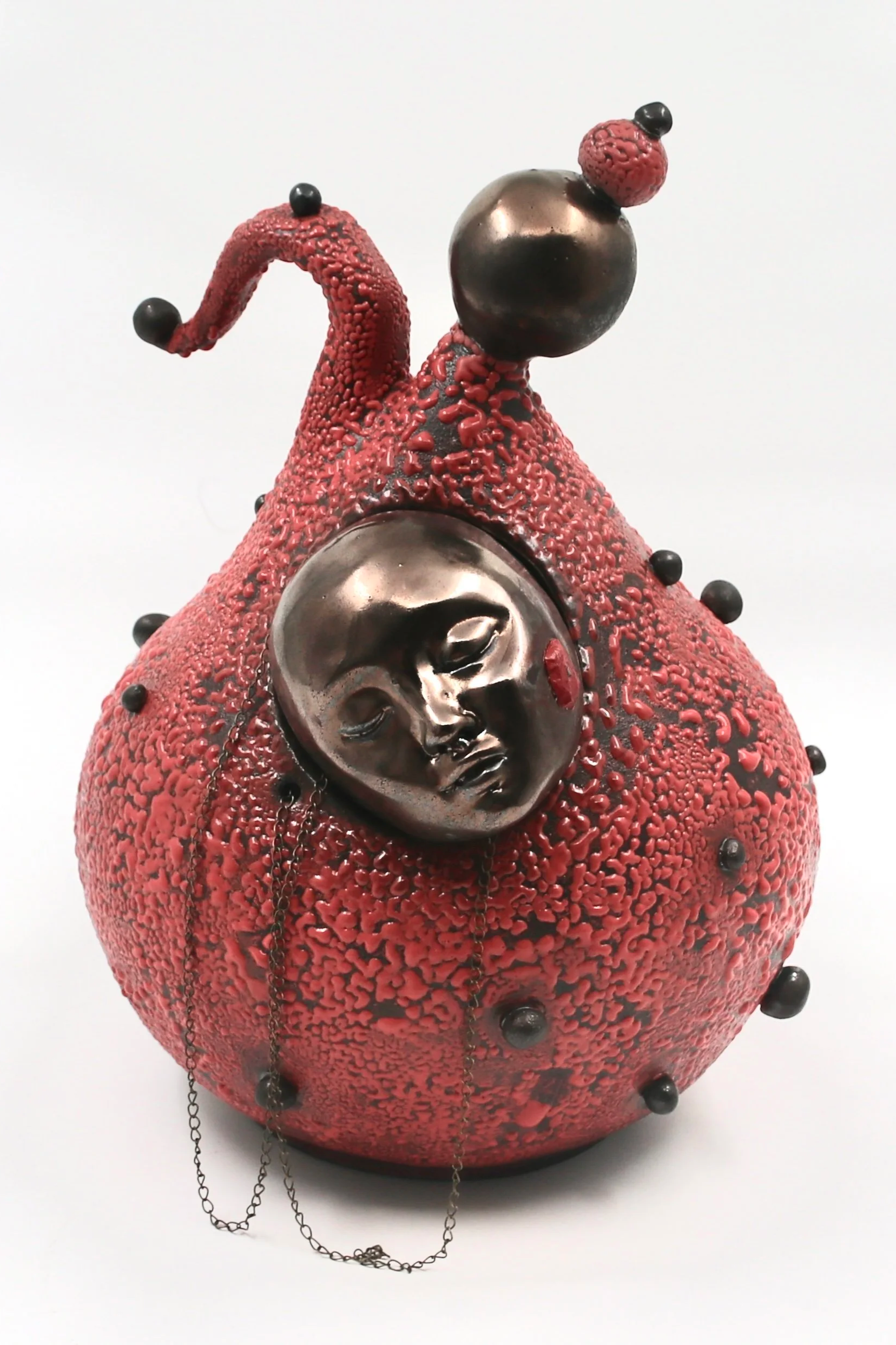 "The Stem Cell". Ceramics. Black stone clay, glazes, brass chain. Cone 6, oxidation. 2026