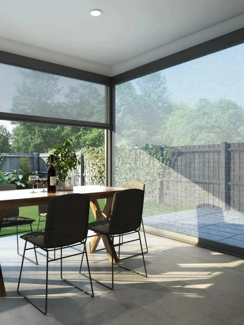 Covered outdoor dining area with custom motorized patio shades by Smart Shade Studio, featuring Clara Shades outdoor solar screens for sun protection, privacy, and modern indoor outdoor living.