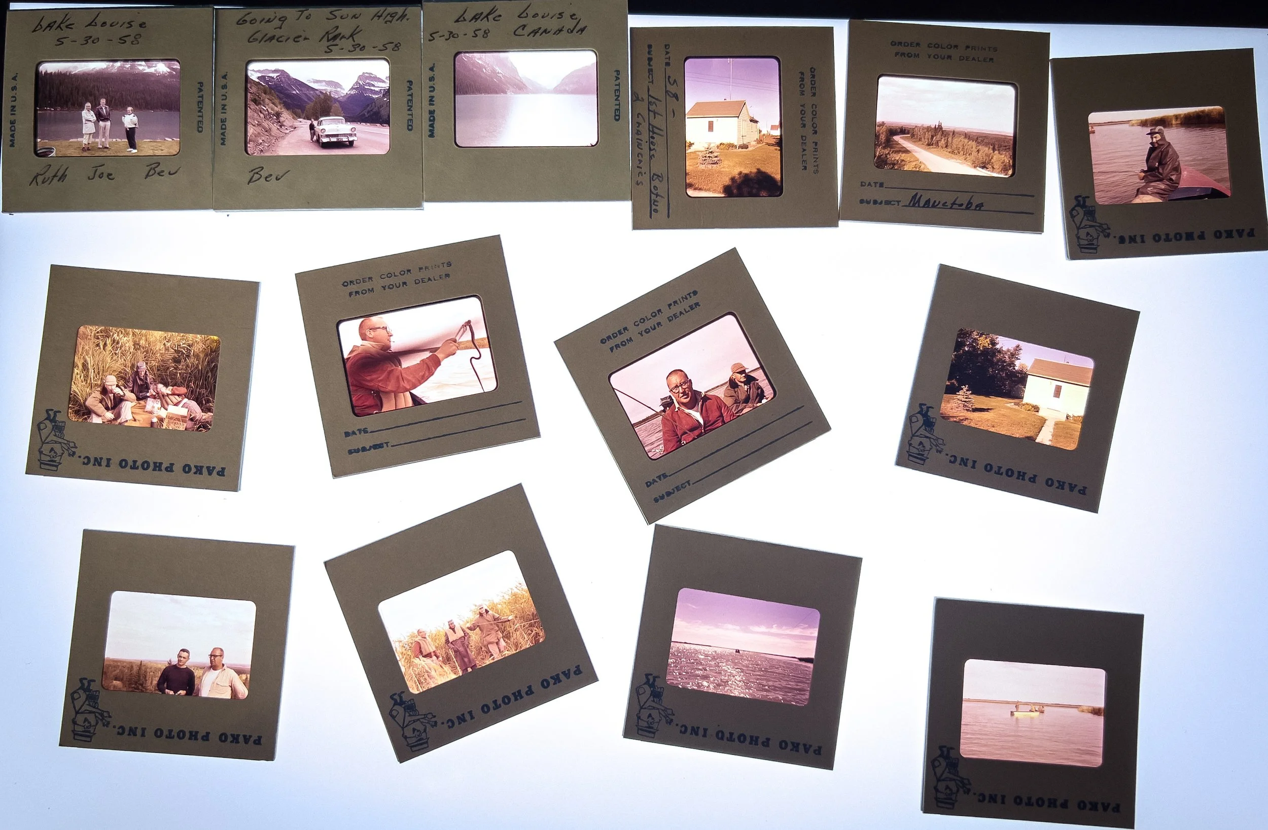 Collection of vintage photo slides with handwritten labels and images of people, scenic views, and outdoor activities.