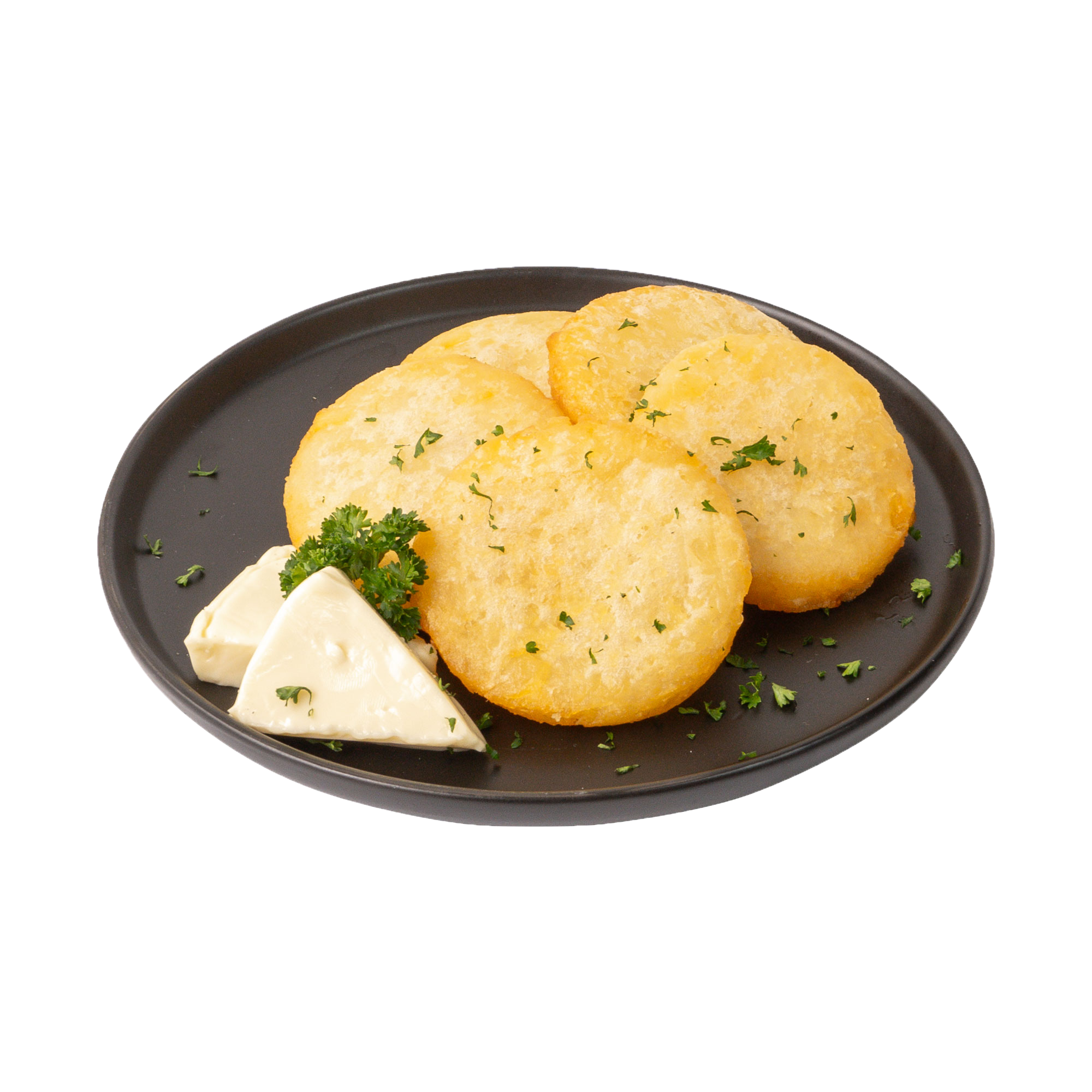 Tres arepas de yuca acompañadas con cilantro, una porción de mantequilla y cilantro fresco en un plato negro