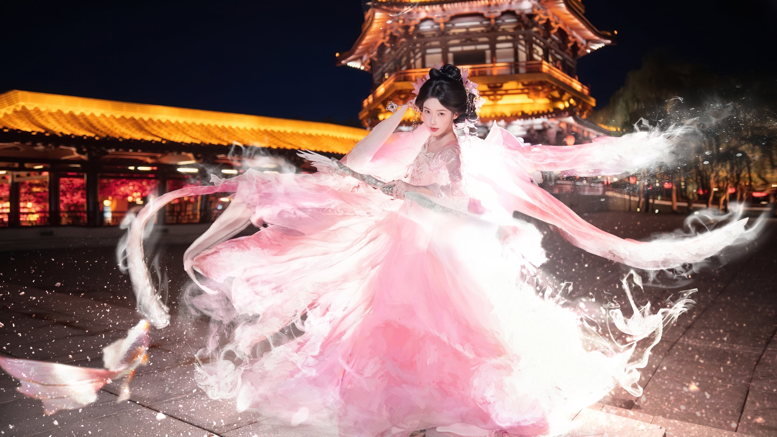 A woman in a traditional pink kimono holding a sword, surrounded by glowing pink and white swirling effects, in front of a pagoda at night.