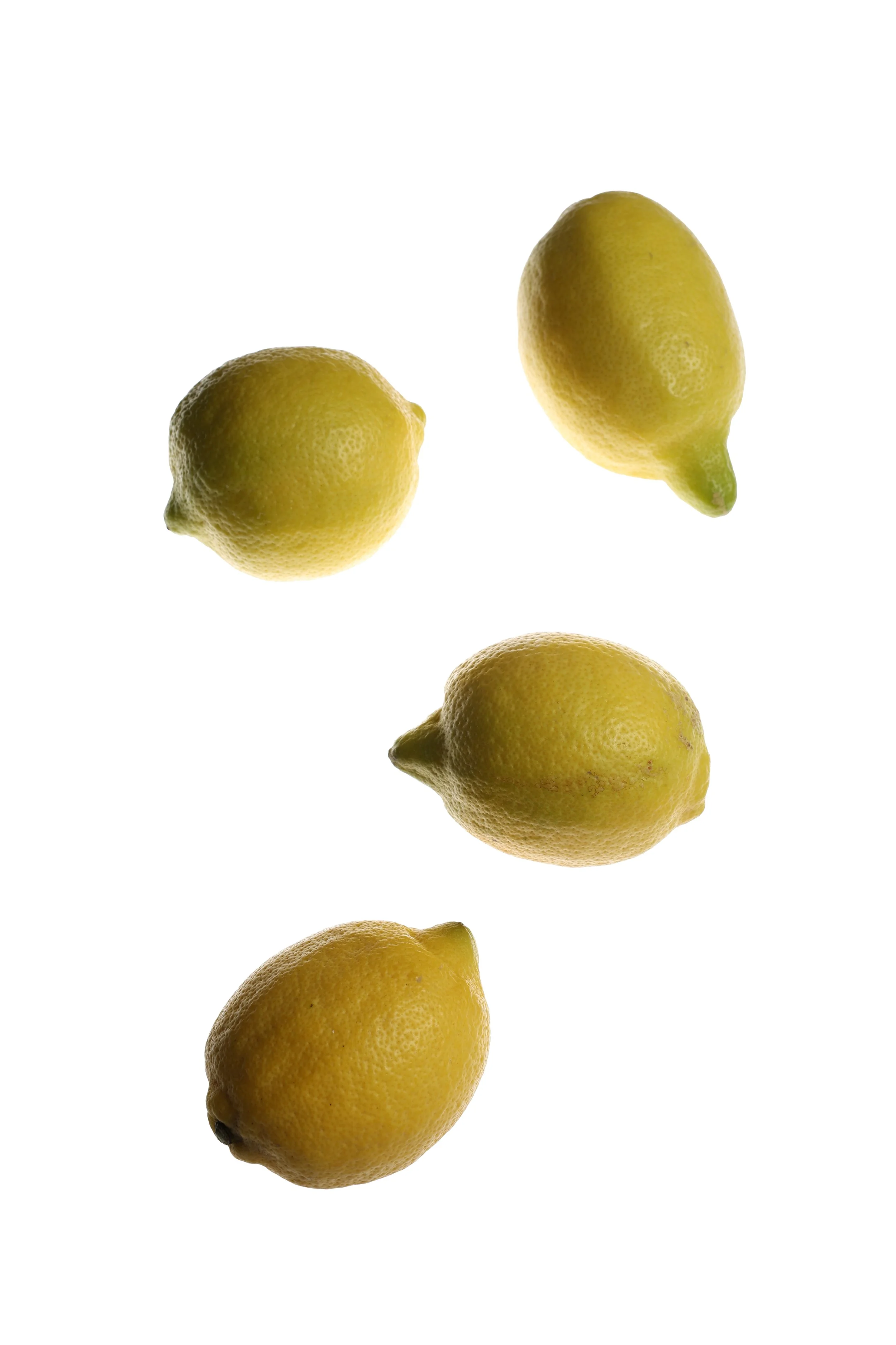 Four yellow lemons arranged in a pattern on a white background.