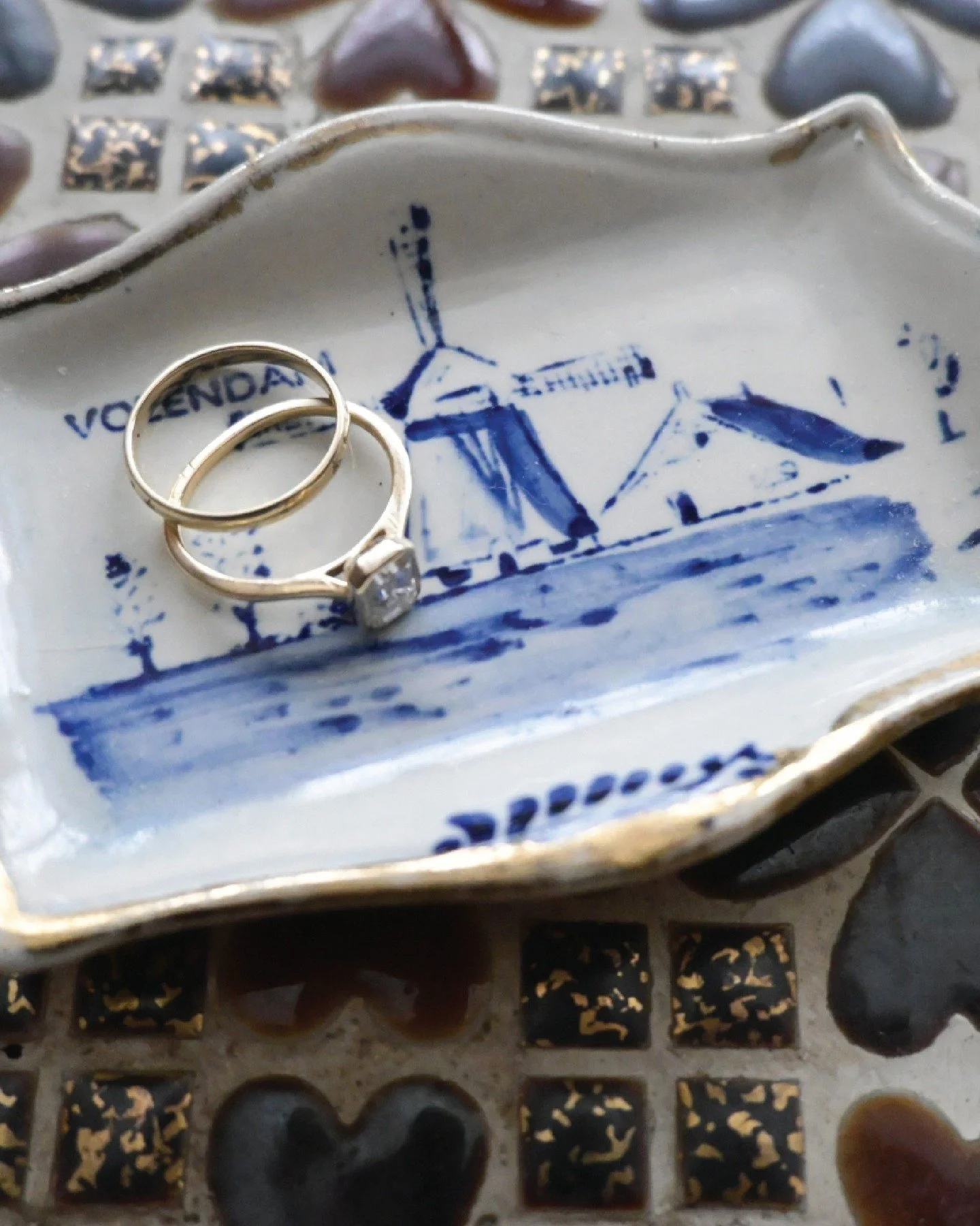 Volendam windmill, chipped corner, someone's souvenir from a trip they took decades ago. Now it holds rings. Small things deserve good homes.