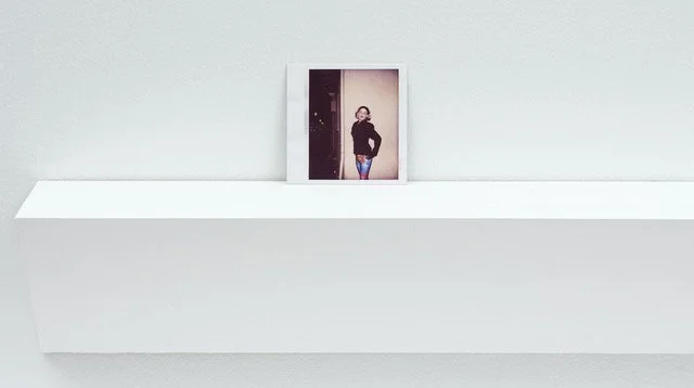 Polaroid photograph on shelf