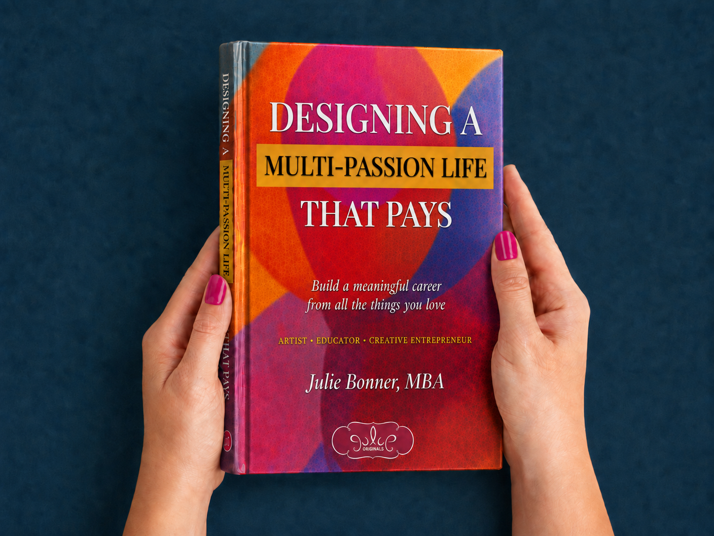 Cover of a book titled "Designing a Multi-Passion Life That Pays" by Julie Bonner, MBA, with a colorful abstract background and the subtitle "Build a meaningful career from all the things you love."