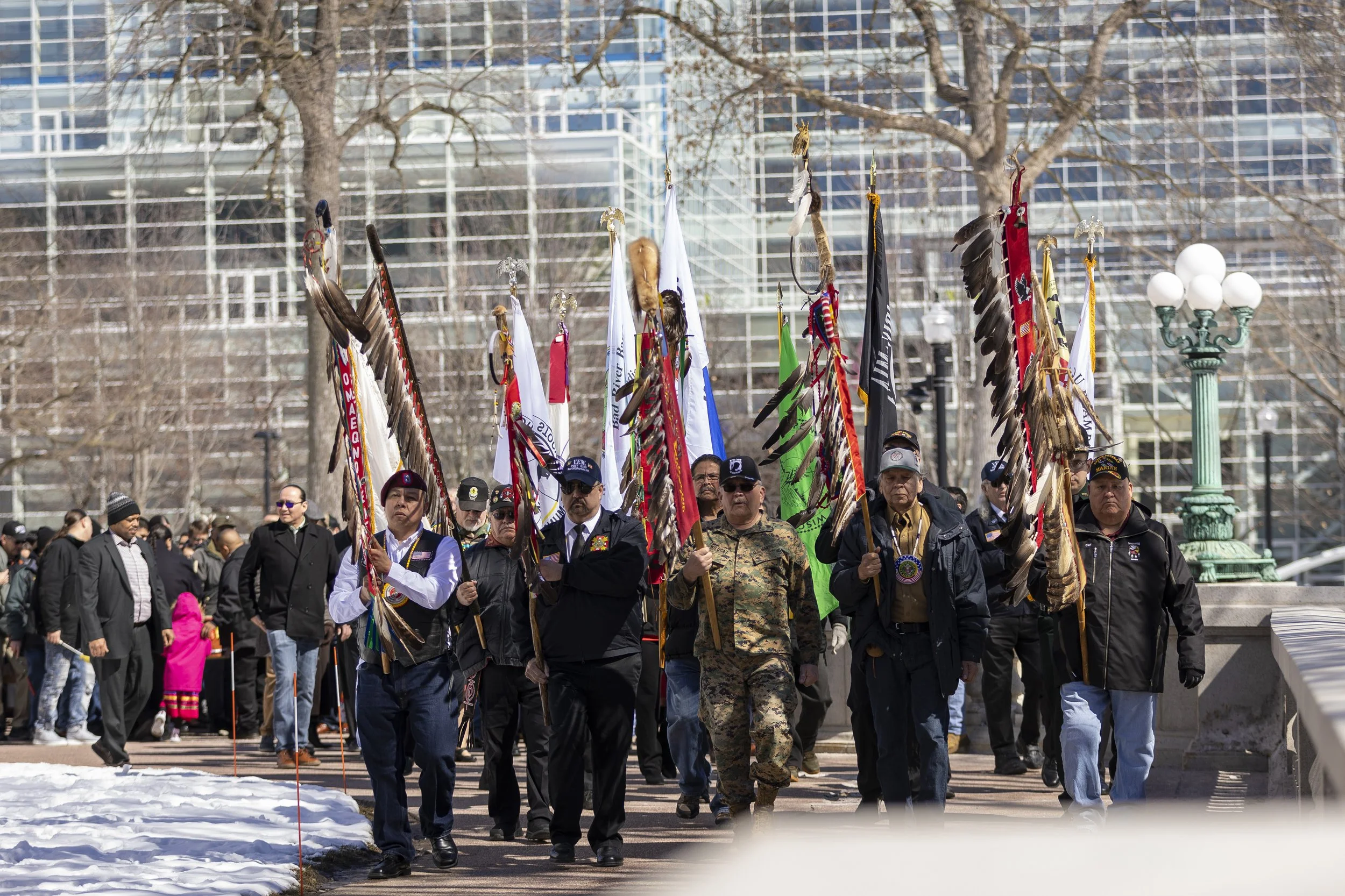 Native Veterans carrying eagle staffs and flags staffs at the Wisconsin State of the Tribes address held at the capitol in Madison, Wisconsin